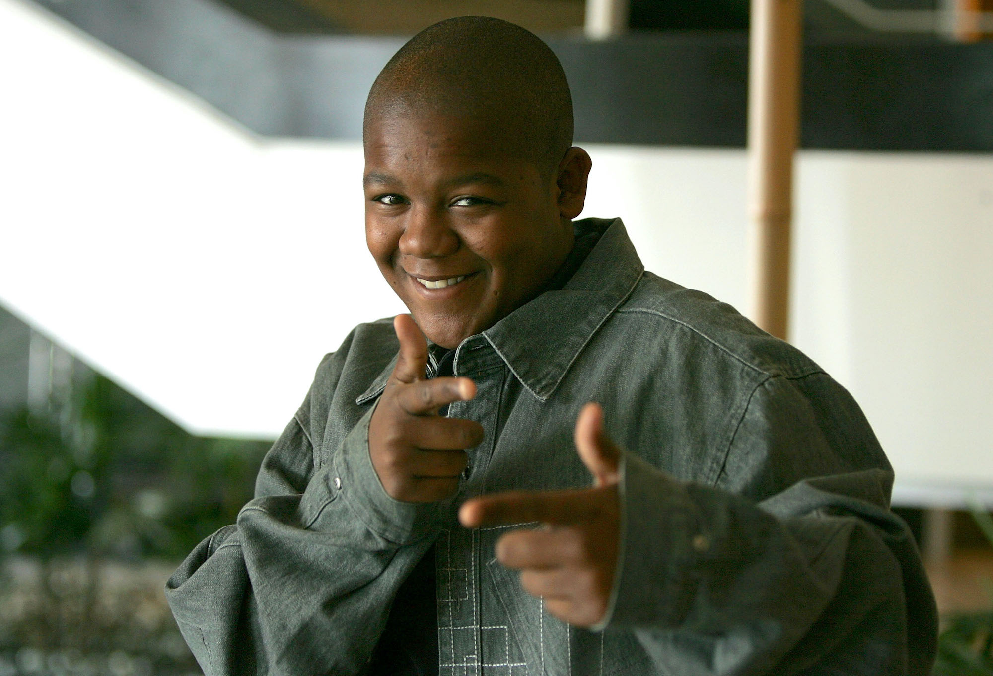 Kyle Massey smiling and pointing at the camera