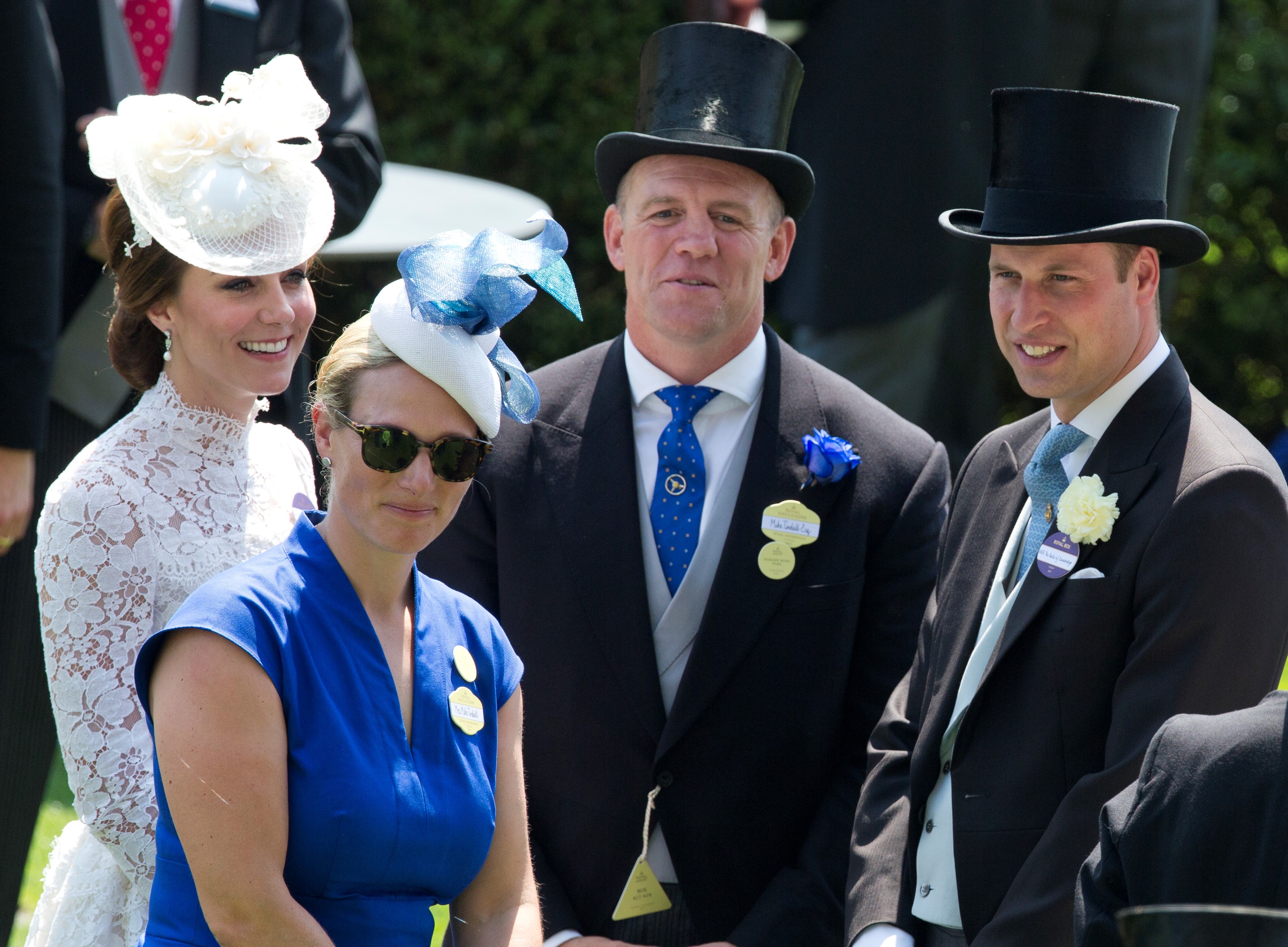(L to R): Kate Middleton, Zara Phillips, Mike Tindall, and Prince William smiling together at Royal Ascot
