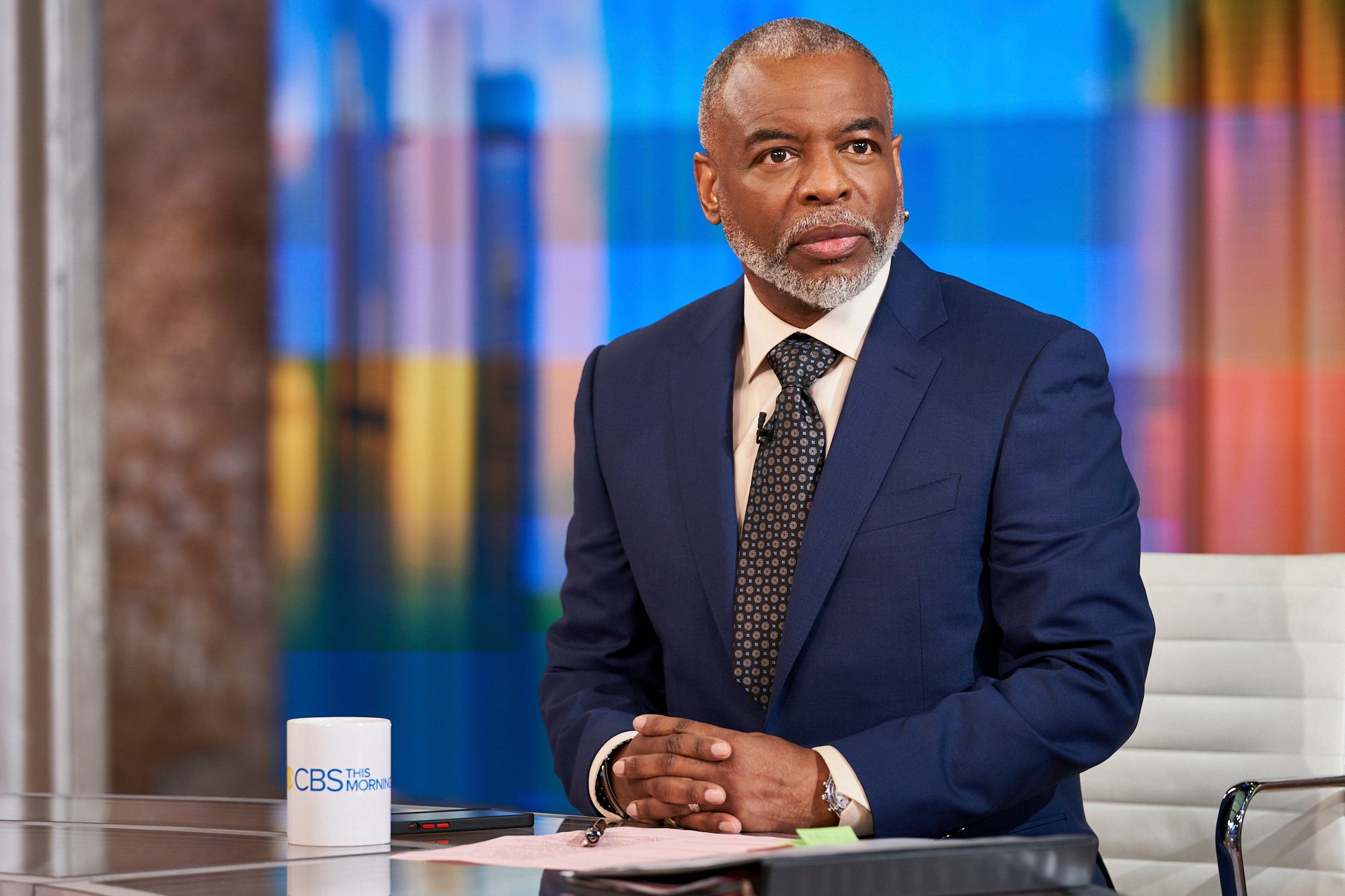 Actor LeVar Burton wears a navy blue suit and dark tie as he guest hosts on 'CBS This Morning' in May 2021.