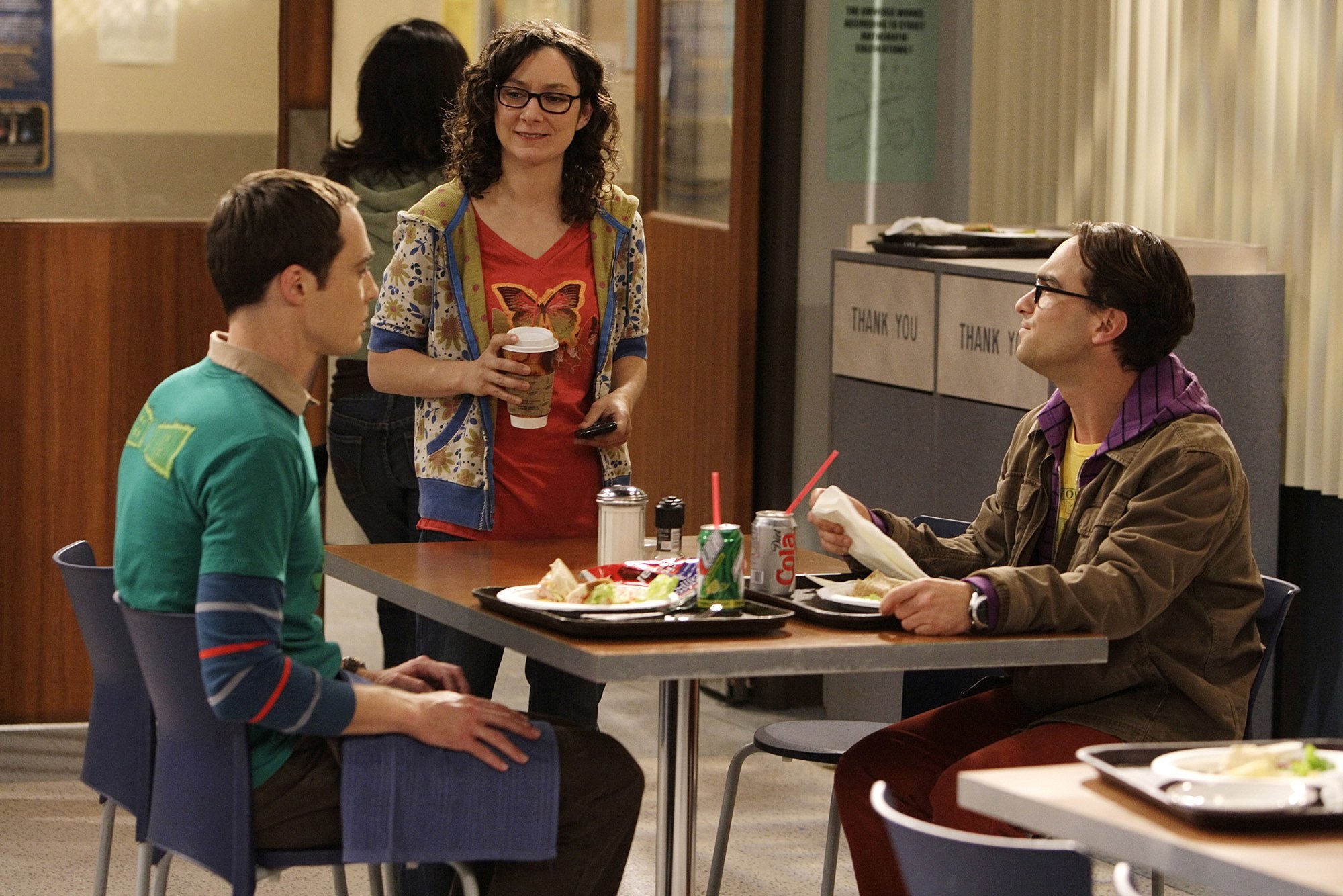 Sheldon Cooper and Leonard Hofstadter have lunch at Caltech. Leslie Winkle stands next ot their table