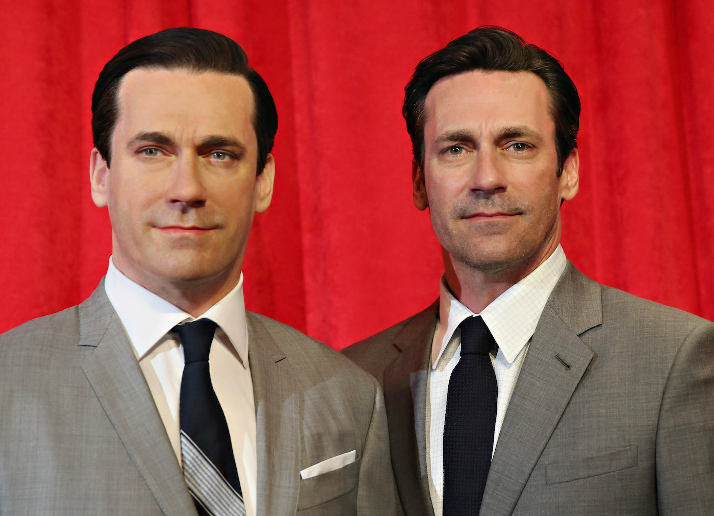 Actor Jon Hamm (right) stands next to his wax figure at Madame Tussauds in New City on May 9, 2014