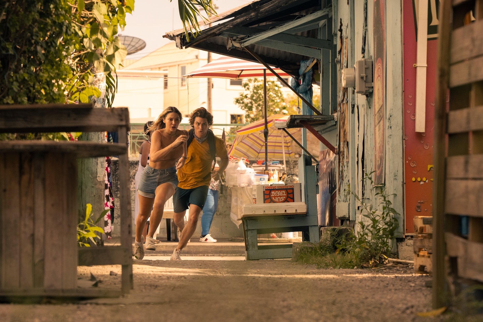 MADELYN CLINE as SARAH CAMERON and CHASE STOKES as JOHN B in 'The Heist' episode of 'Outer Banks' Season 2