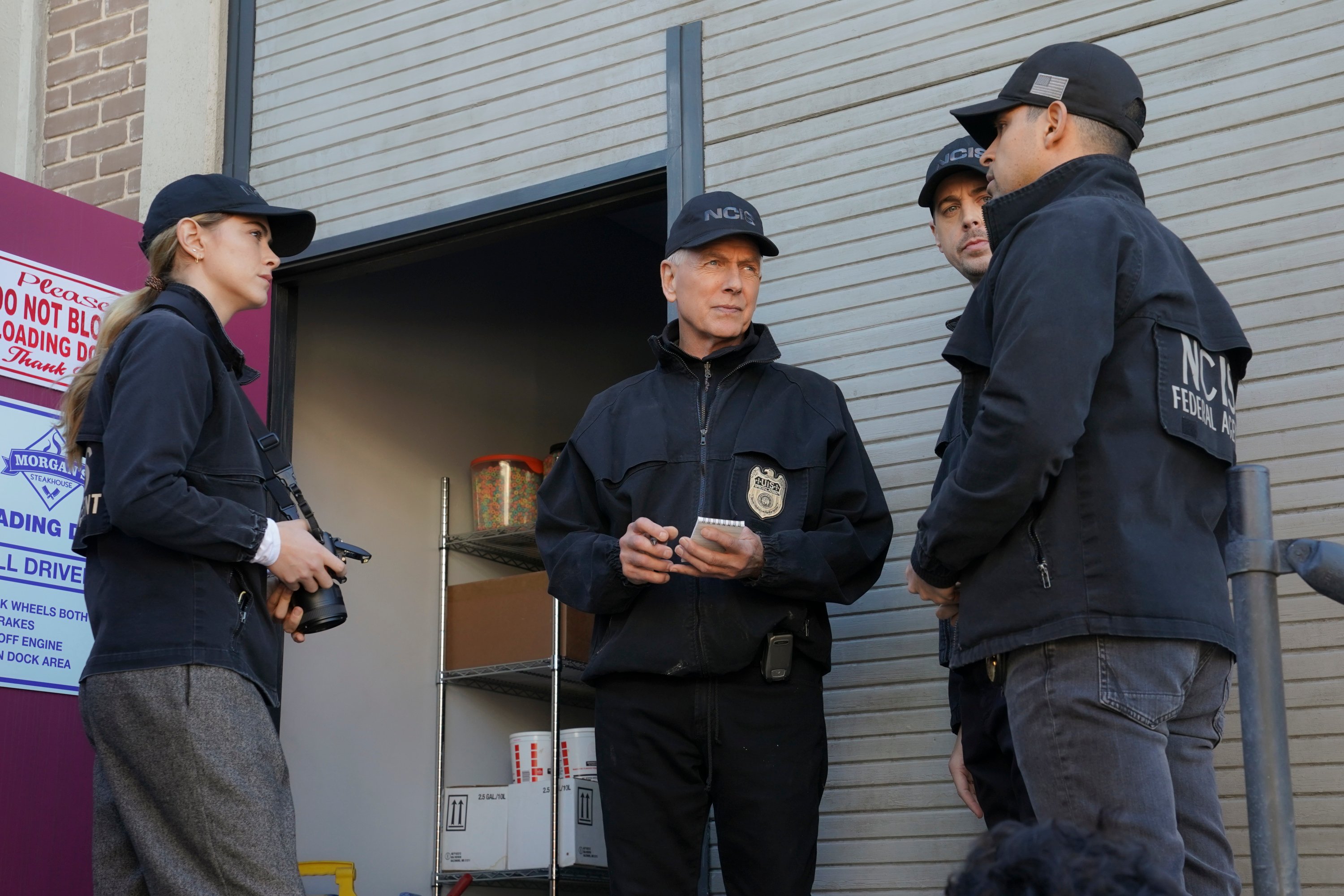 Mark Harmon with the NCIS team