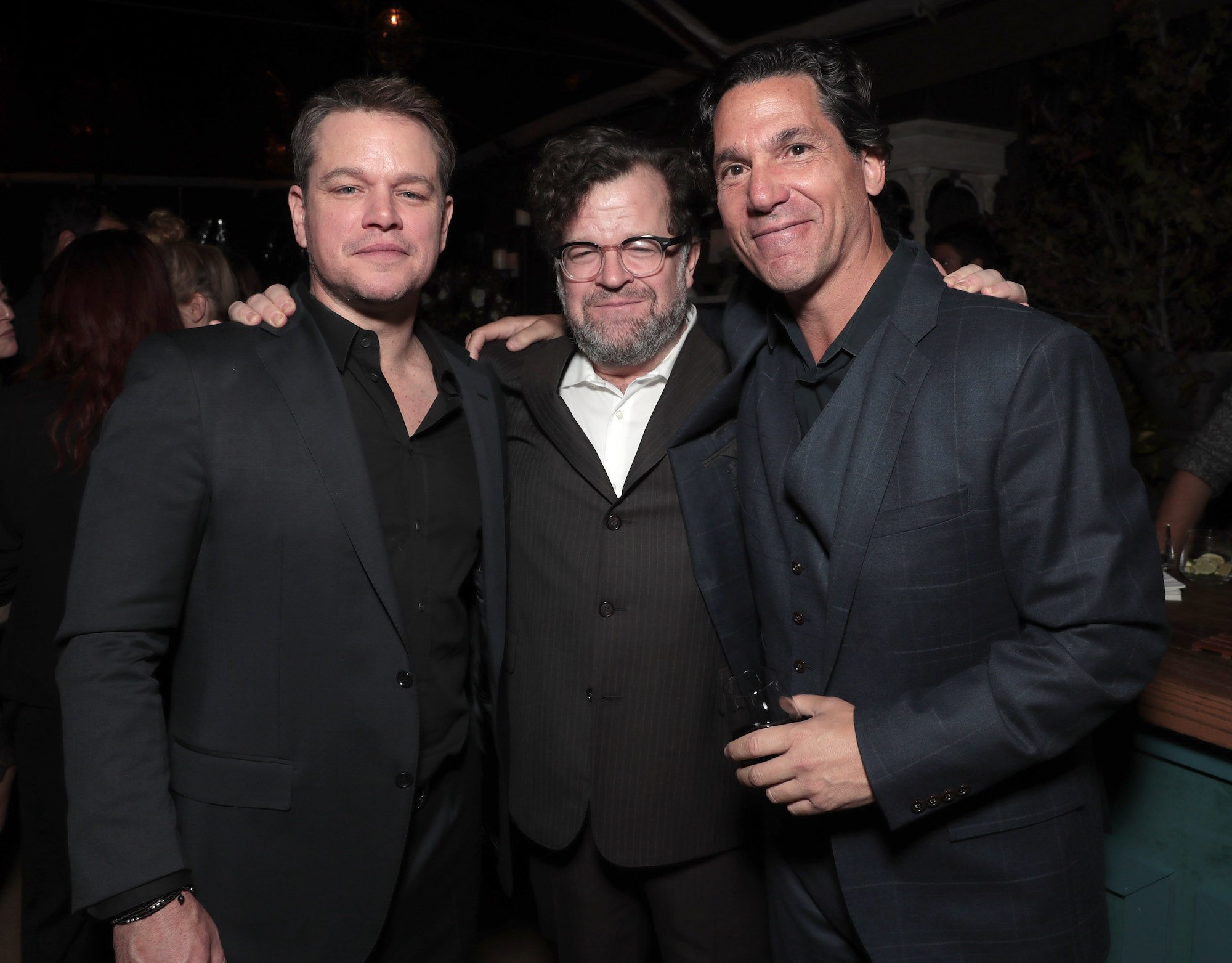 Mathew Rosengart smiling next to Matt Damon and Kenneth Lonergan at Jeff Bezos and Matt Damon's "Manchester By The Sea" Holiday Party