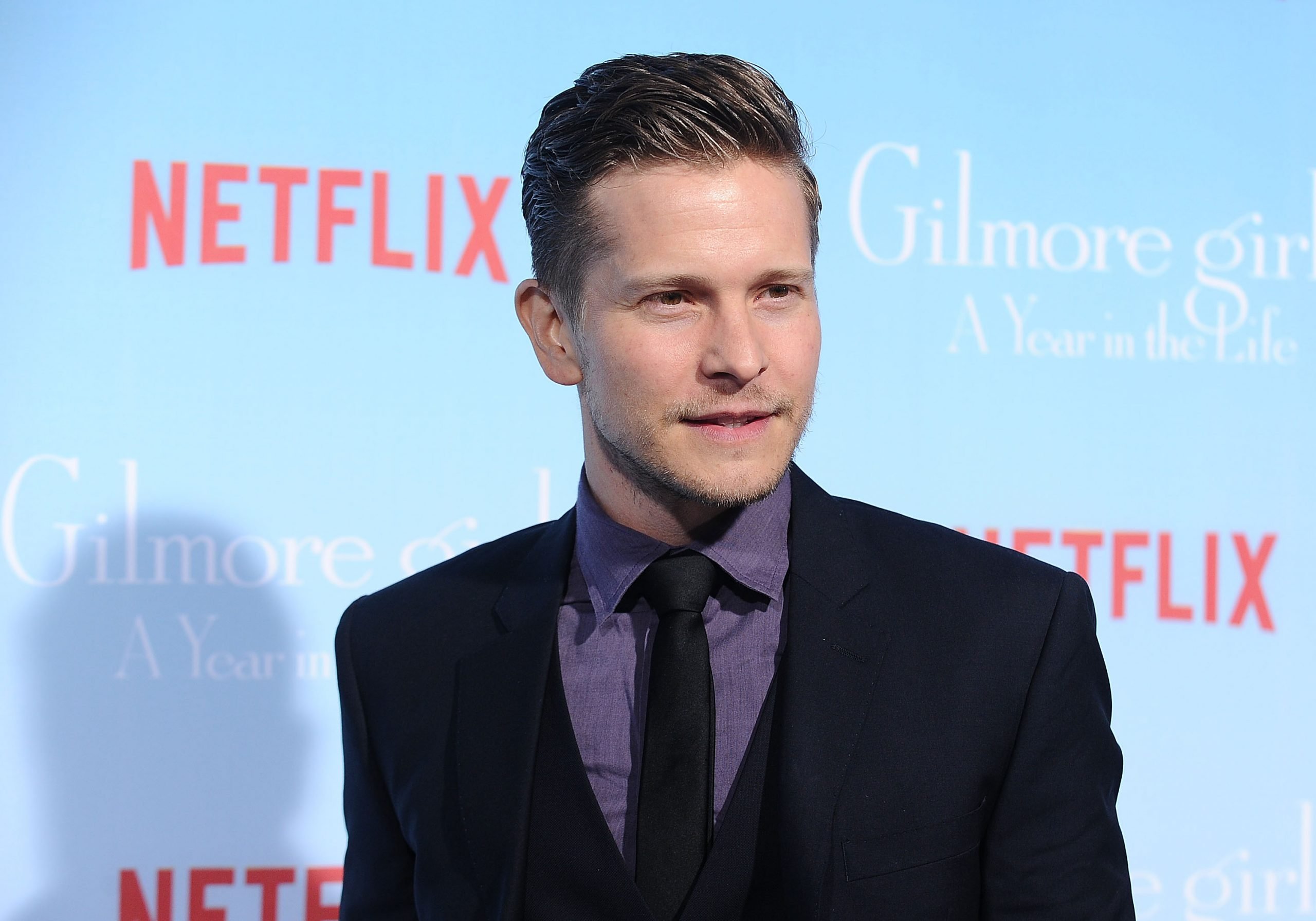 Matt Czuchry poses for a photo at the premiere of 'Gilmore Girls: A Year in the Life' in 2016