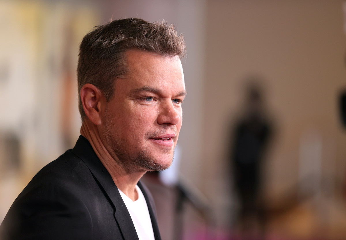 Matt Damon smiles and poses on the red carpet