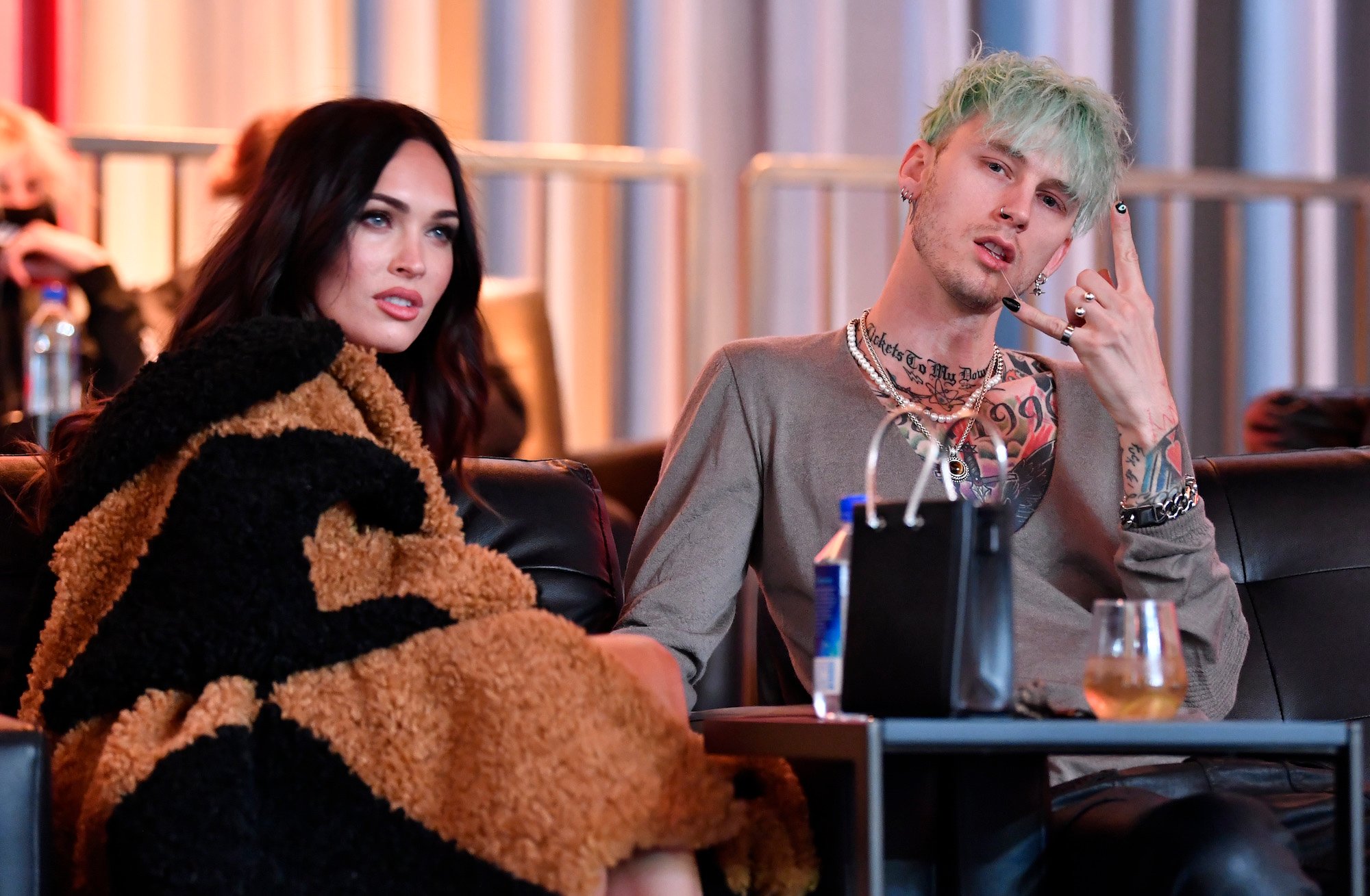 Megan Fox and Machine Gun  Kelly attending the UFC 260: Miocic v Ngannou fight in March 2021