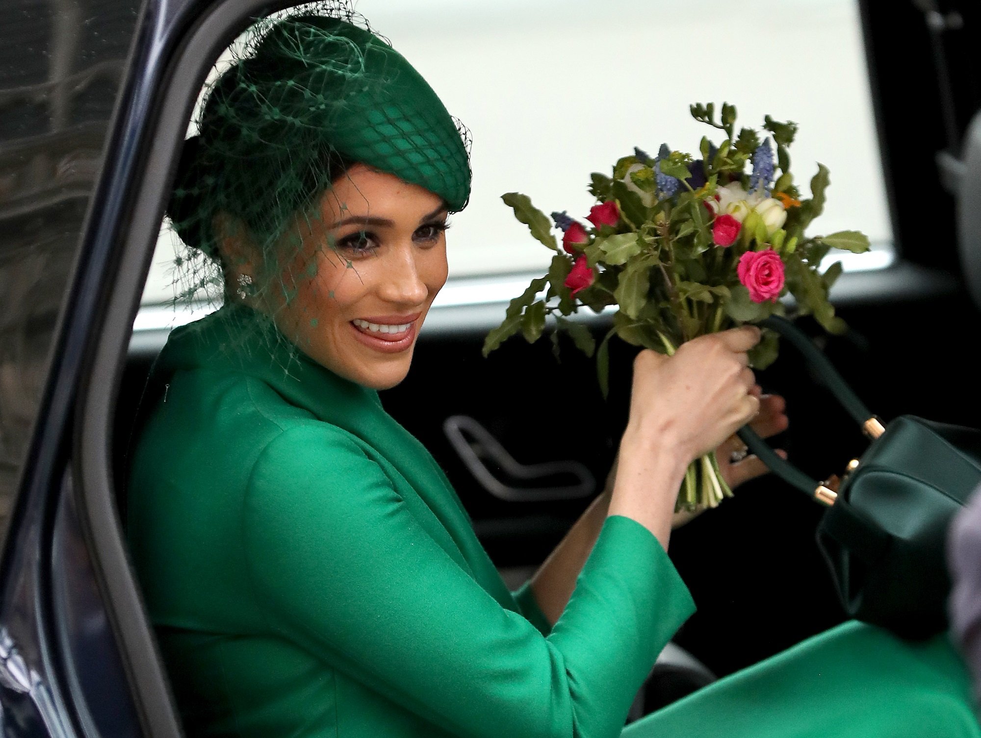 Meghan Markle the Duchess of Sussex, seen here in a green dress sitting in a car, has allegedly ruined a local Starbucks for the worse