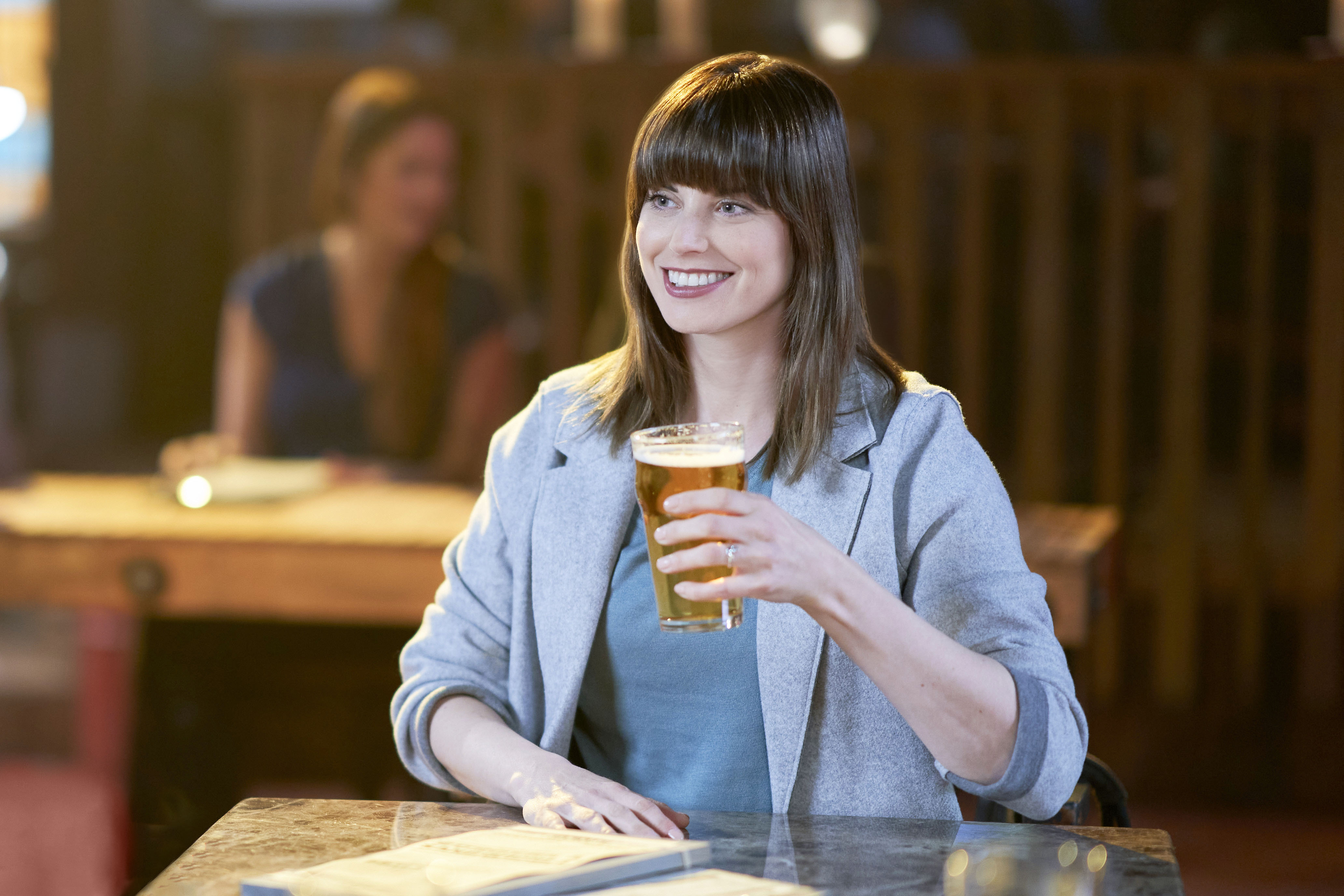 Meghan Ory as Abby, holding a beer, in 'Chesapeake Shores' Season 5