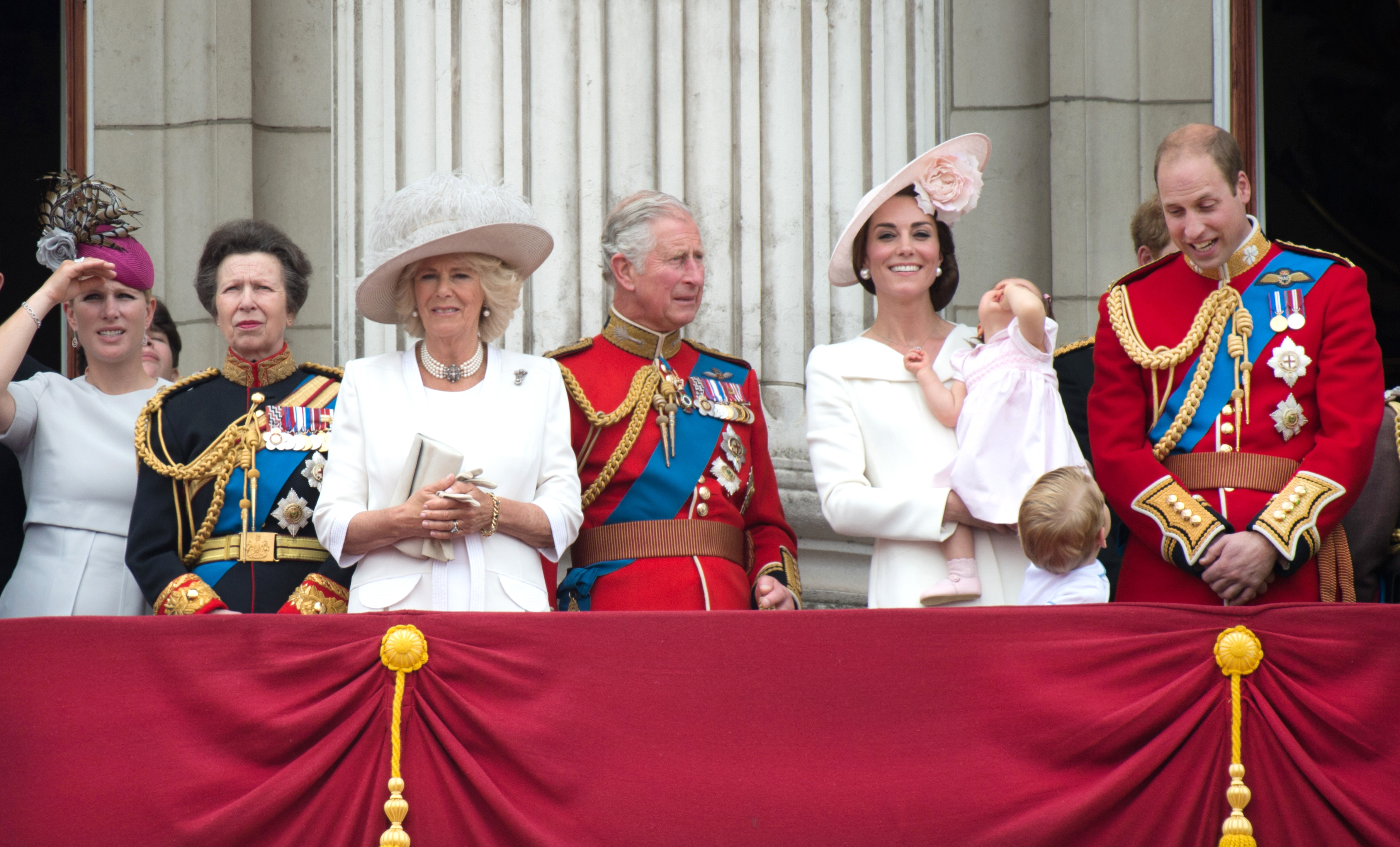 Members of the British royal family standing on the Buckingham Palace balcony