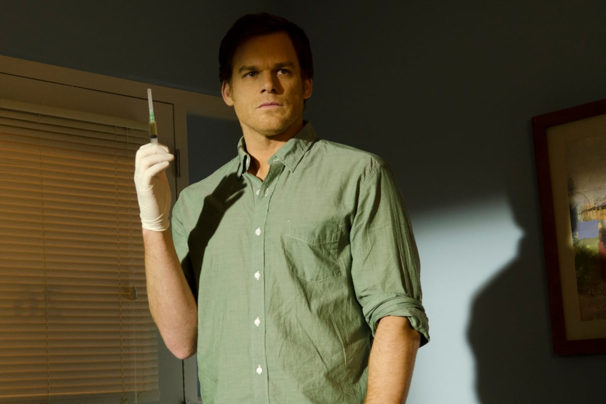 Michael C. Hall as Dexter holds up a syringe