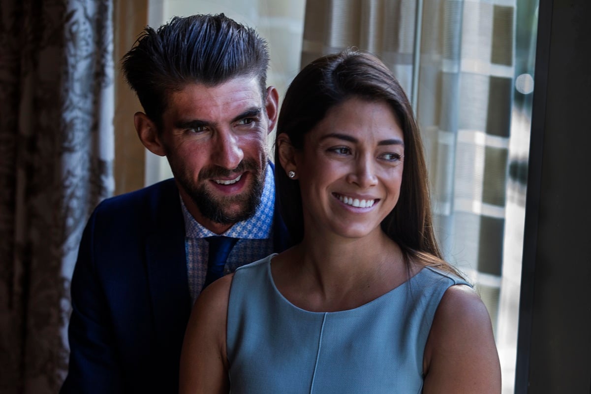 Michael Phelps and his wife Nicole Johnson smiling before receiving the Morton E. Ruderman Award