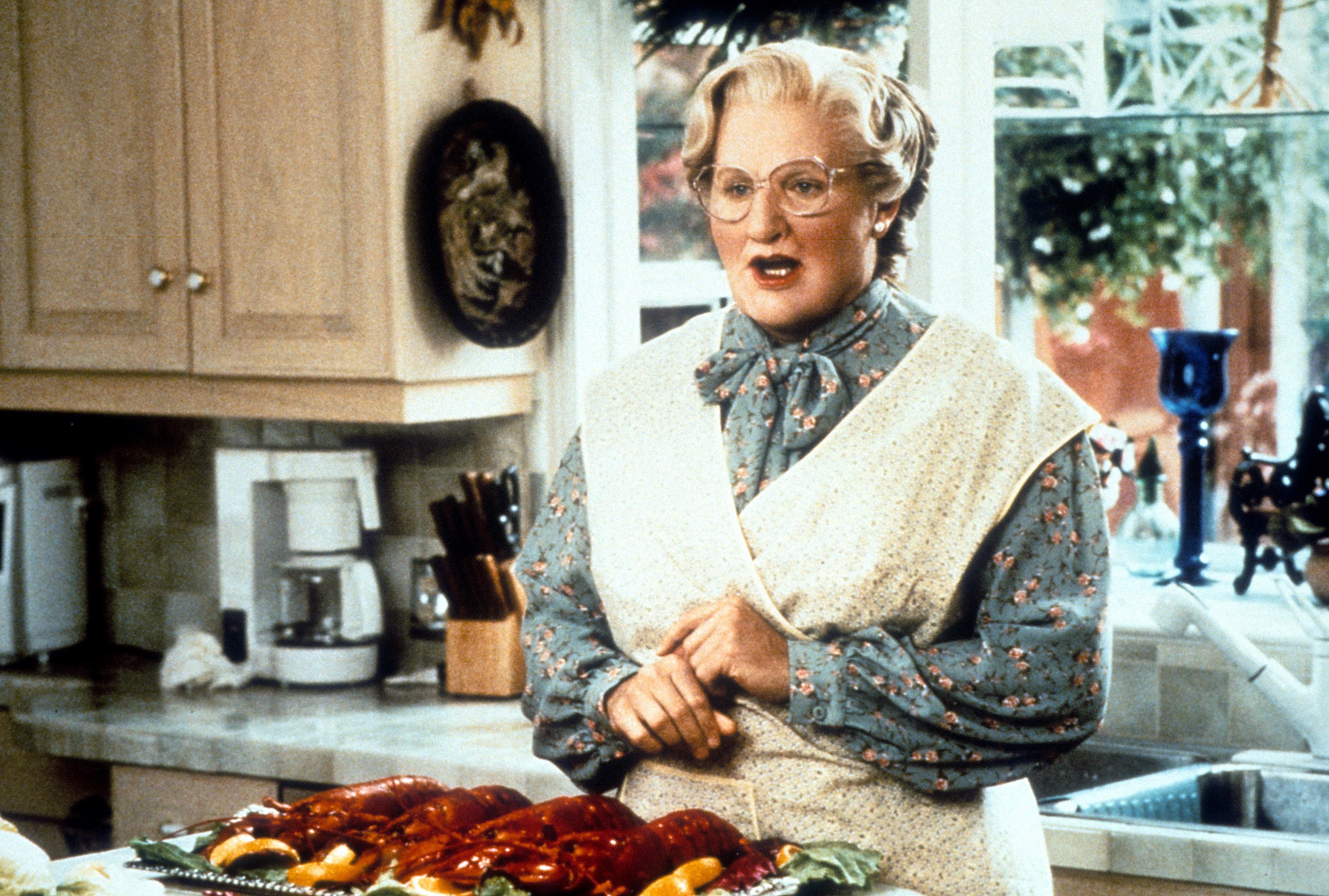 Robin Williams in the kitchen in a scene from the film 'Mrs. Doubtfire'