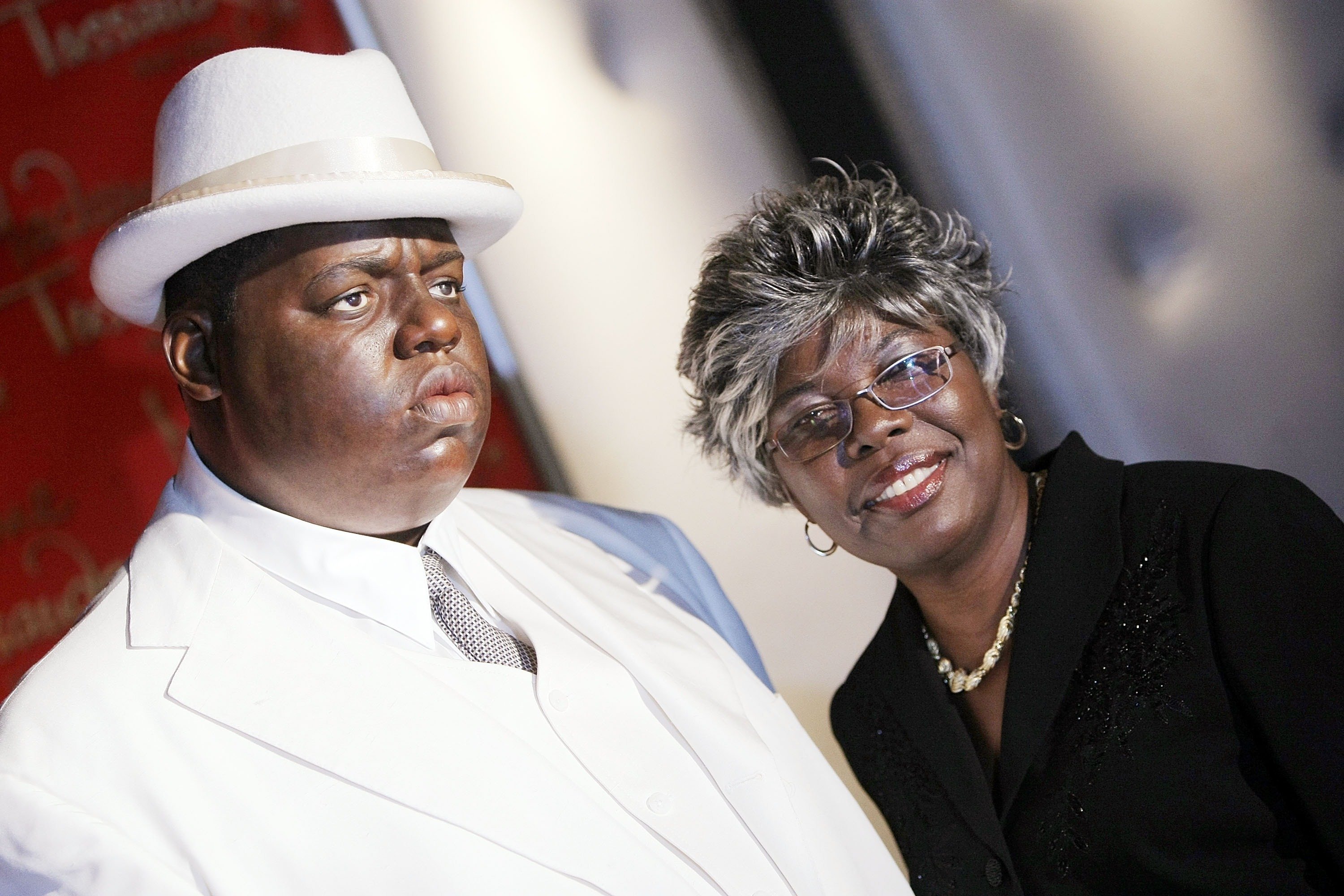 Voletta Wallace poses for a photo with a wax figure of her son Christopher 'Biggie Smalls' Wallace