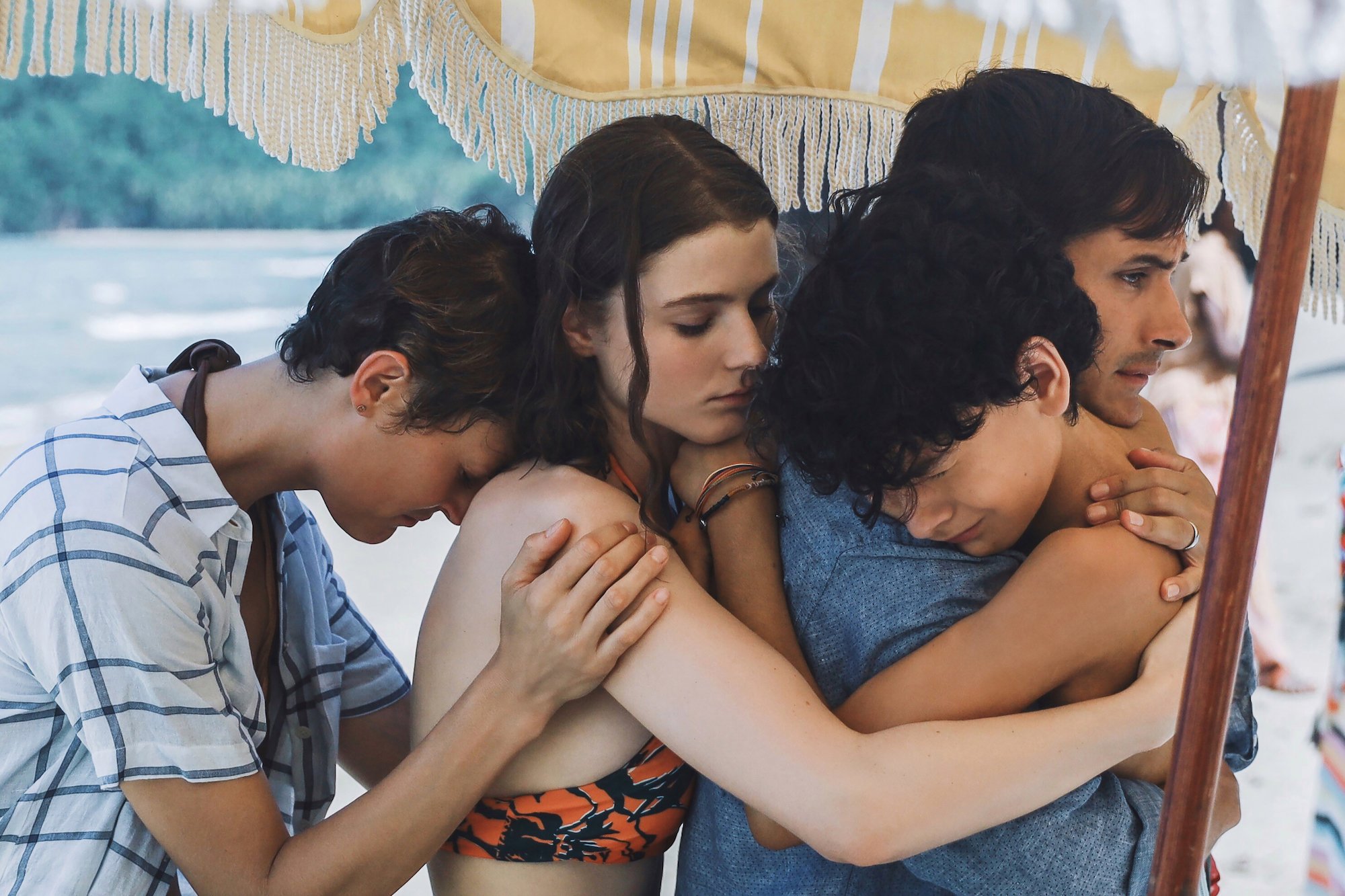 Old: Gael Garcia Bernal and Vicky Krieps hug Thomasin McKenzie and Luca Faustino Rodriguez