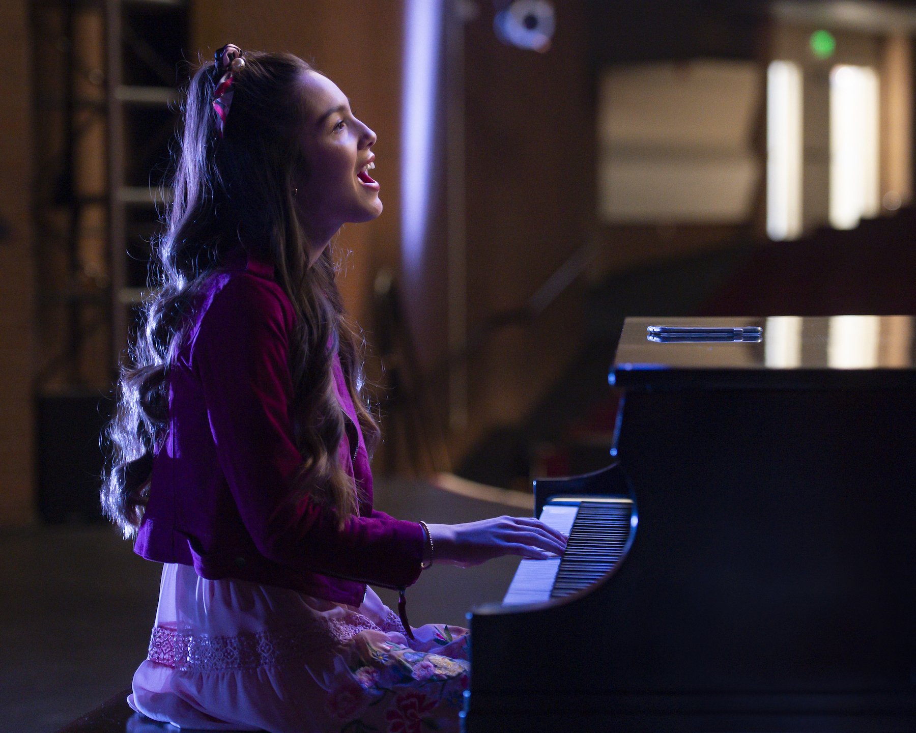 Olivia Rodrigo as Nini in the Disney+ series, 'High School Musical: The Musical: The Series' playing the piano and singing