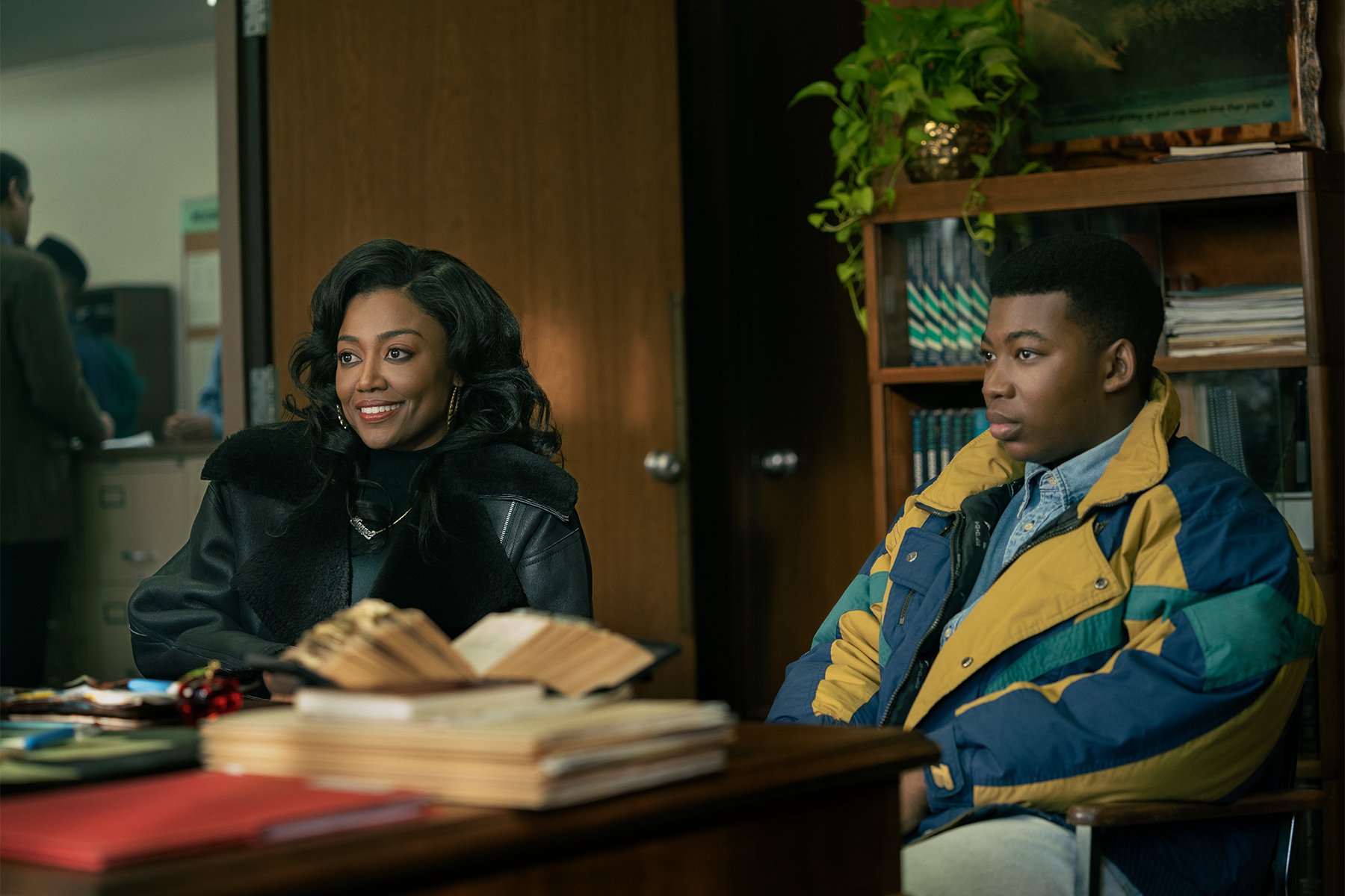 Patina Miller as Raquel "Raq" Thomas and Mekai Curtis as Kanan Stark sitting behind a deskin 'Power Book III: Raising Kanan'