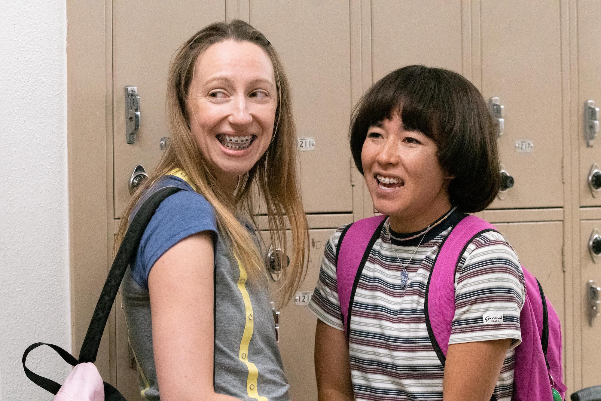 Anna Konkle and Maya Erskine smiling in a still from 'Pen15'