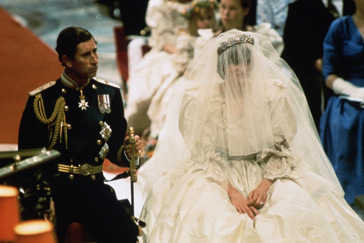 Photo of Prince Charles and Lady Diana Spencer seated during their wedding ceremony