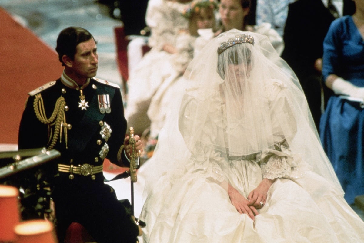 Photo of Prince Charles and Lady Diana Spencer seated during their wedding ceremony