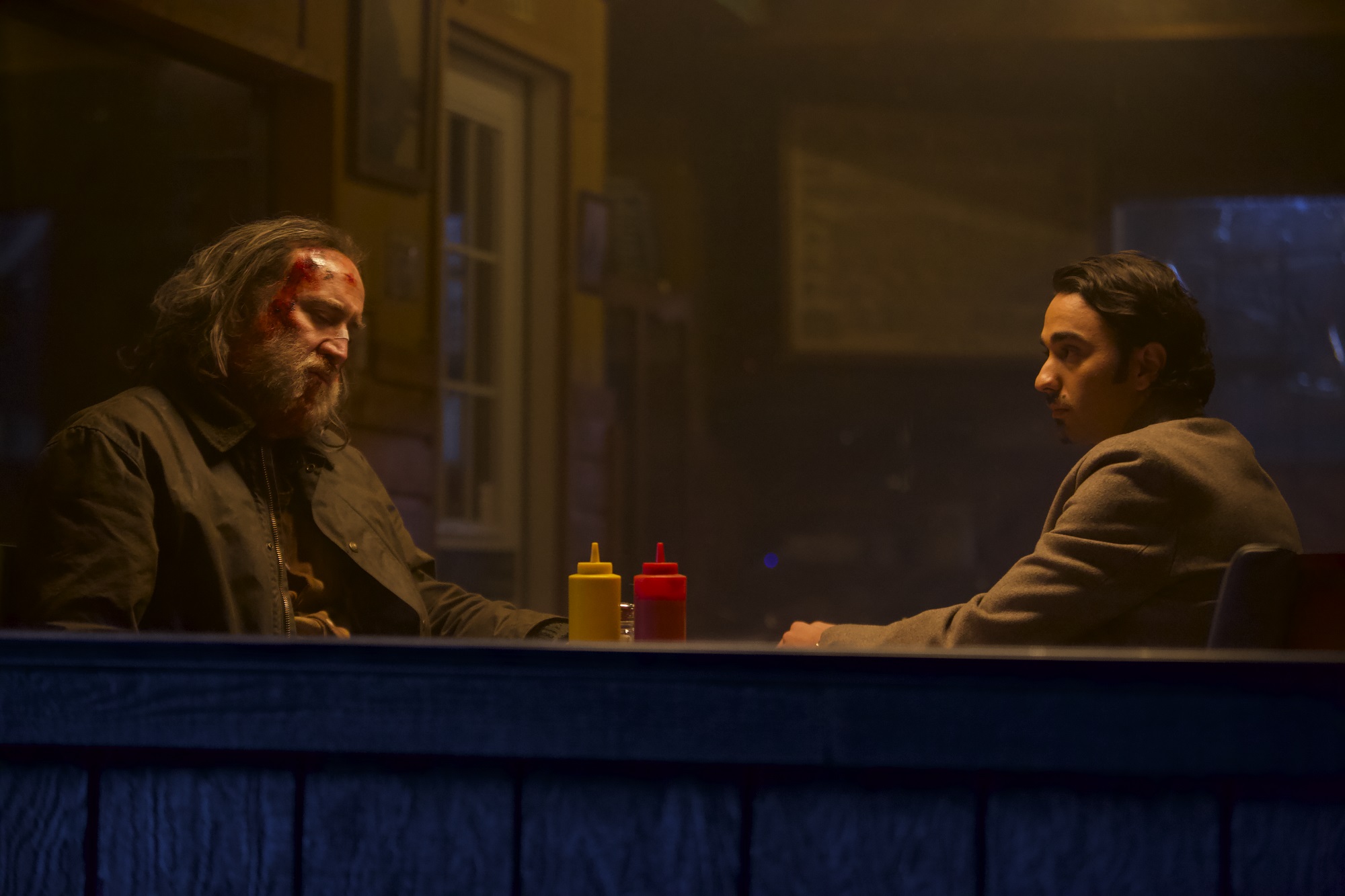 Pig: Nicolas Cage and Alex Wolff sit at a restaurant table