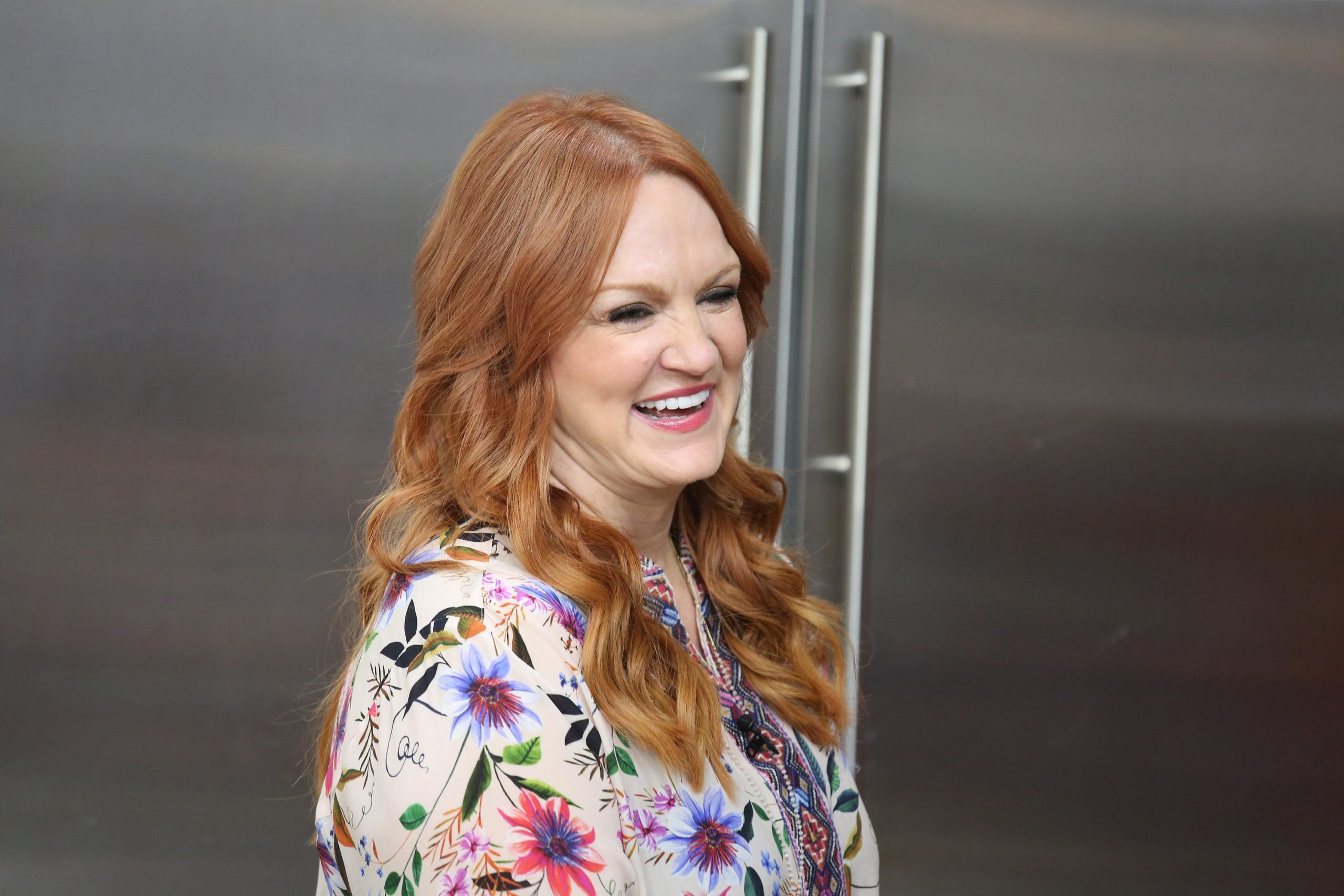'The Pioneer Woman' Ree Drummond wears a print top and smiles at the camera.