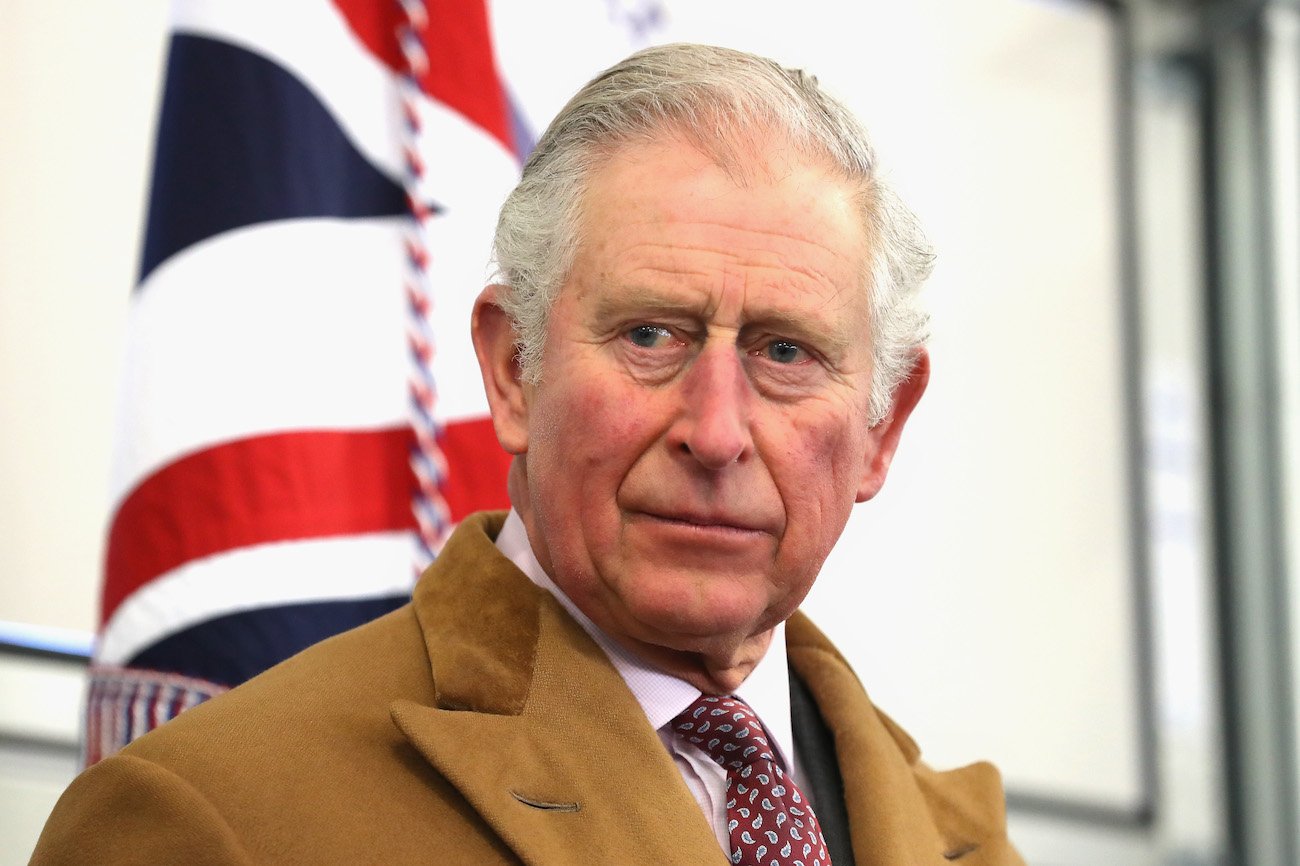 Prince Charles looking on