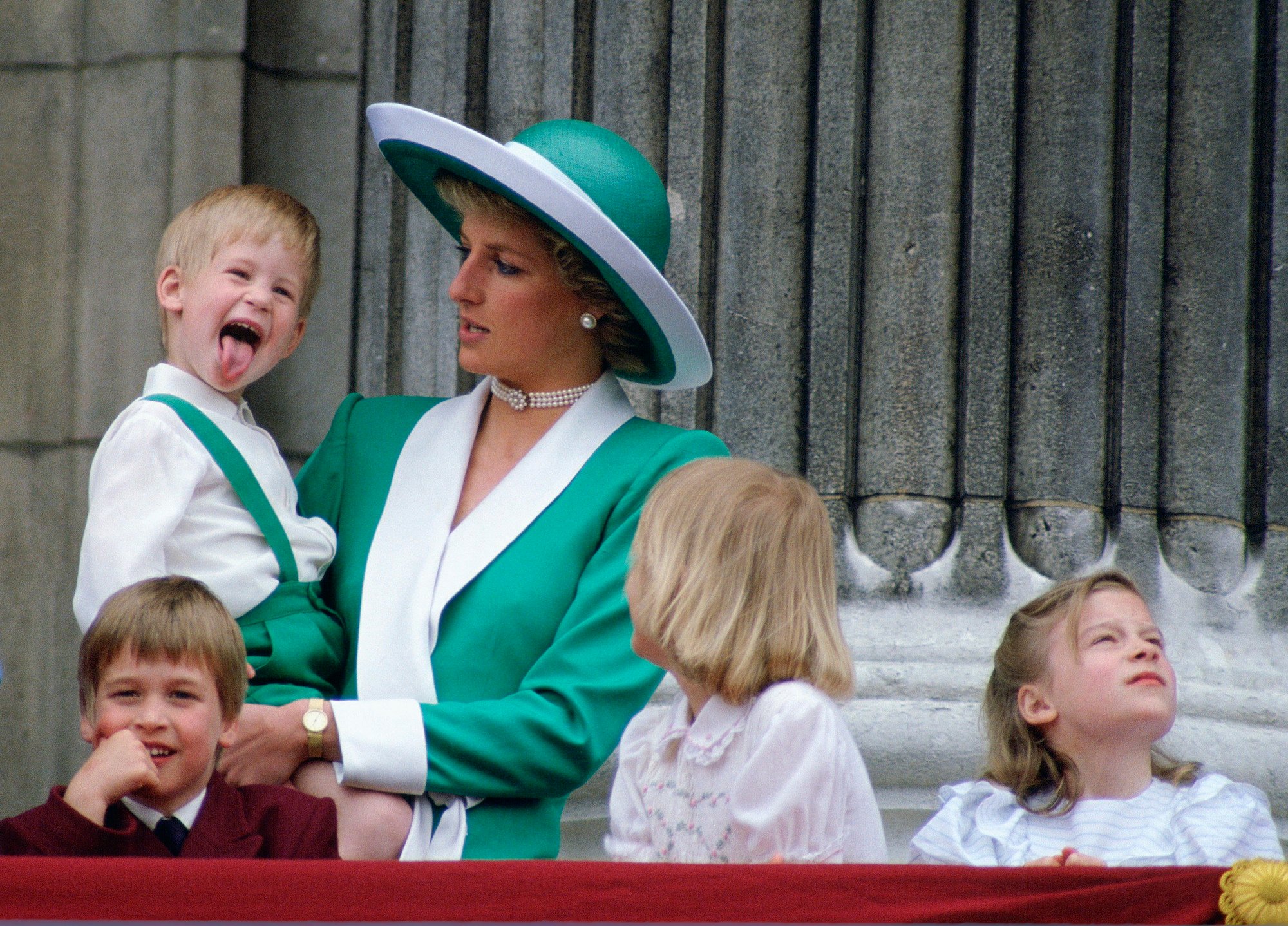 Royal family pictures can be amusing, as seen here with Prince Harry sticking out his tongue.