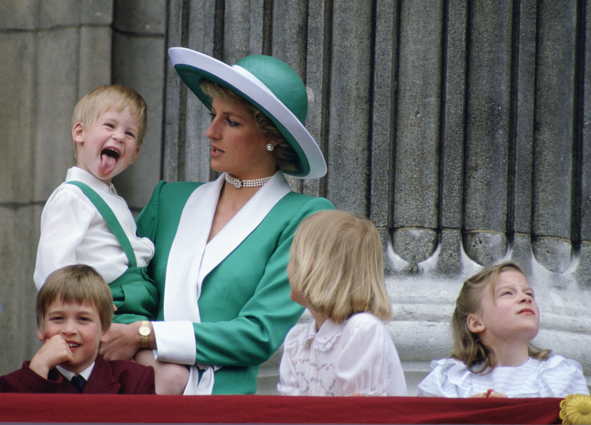 Royal family pictures can be amusing, as seen here with Prince Harry sticking out his tongue.