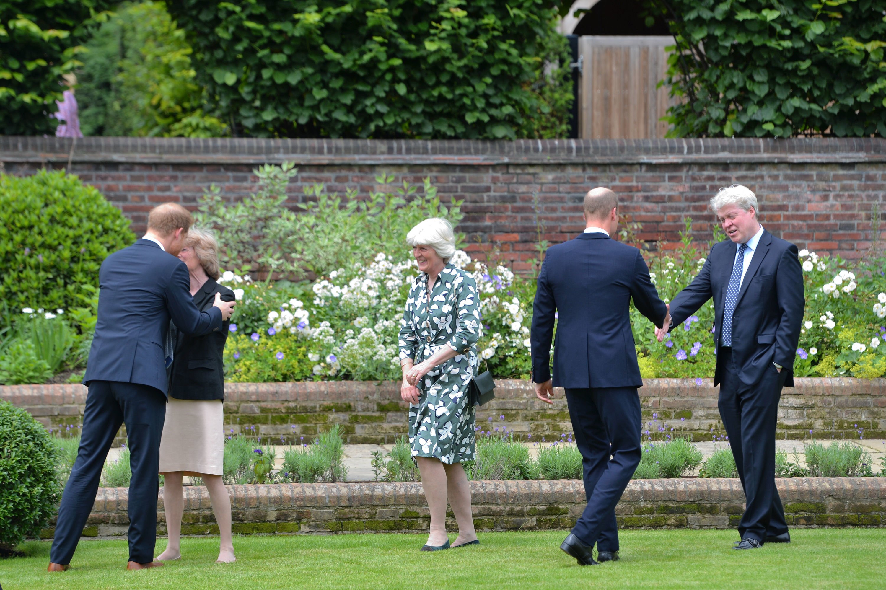 Prince Harry, and Prince William, greet Princess Diana's siblings Lady Sarah McCorquodale, Lady Jane Fellowes, and Earl Spencer at statue unveiling