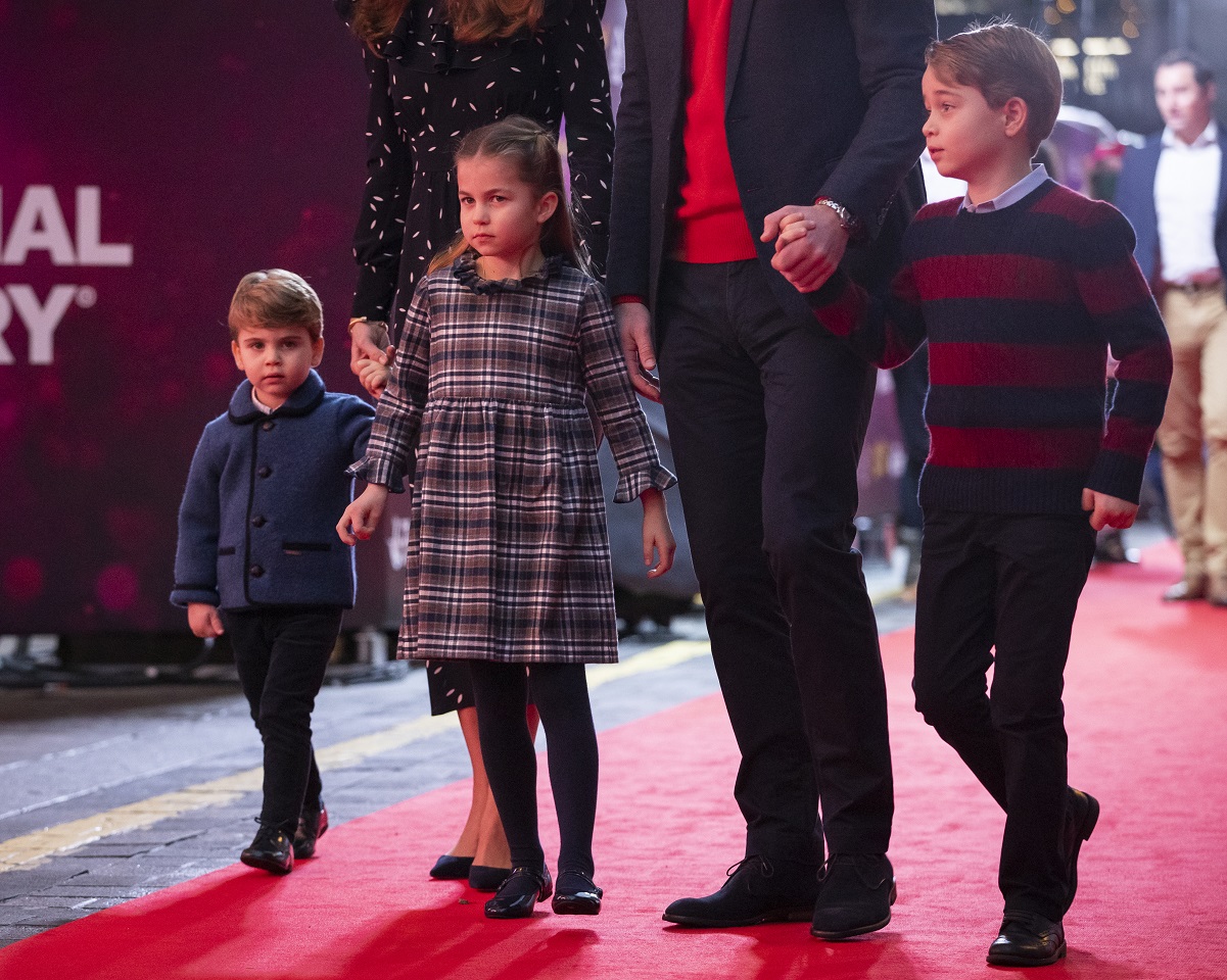 Prince Louis, Princess Charlotte, and Prince George walking on red carpet with their parents at London's Palladium Theatre