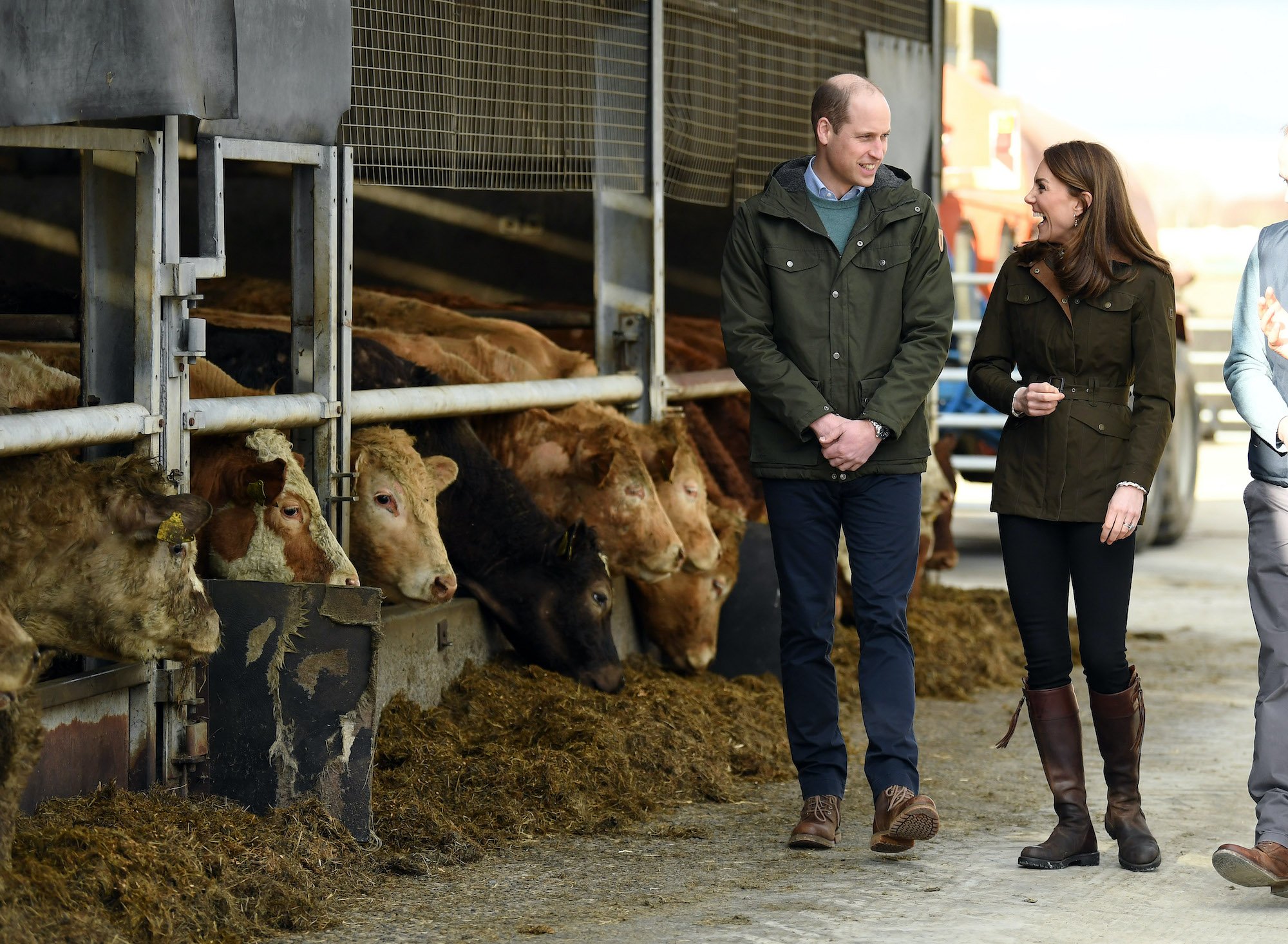 Prince William and Kate Middleton walking though a farm