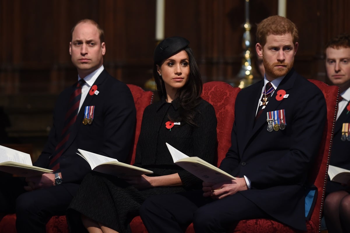 Prince William, Meghan Markle and Prince Harry sitting together during Anzac Day service in 2018
