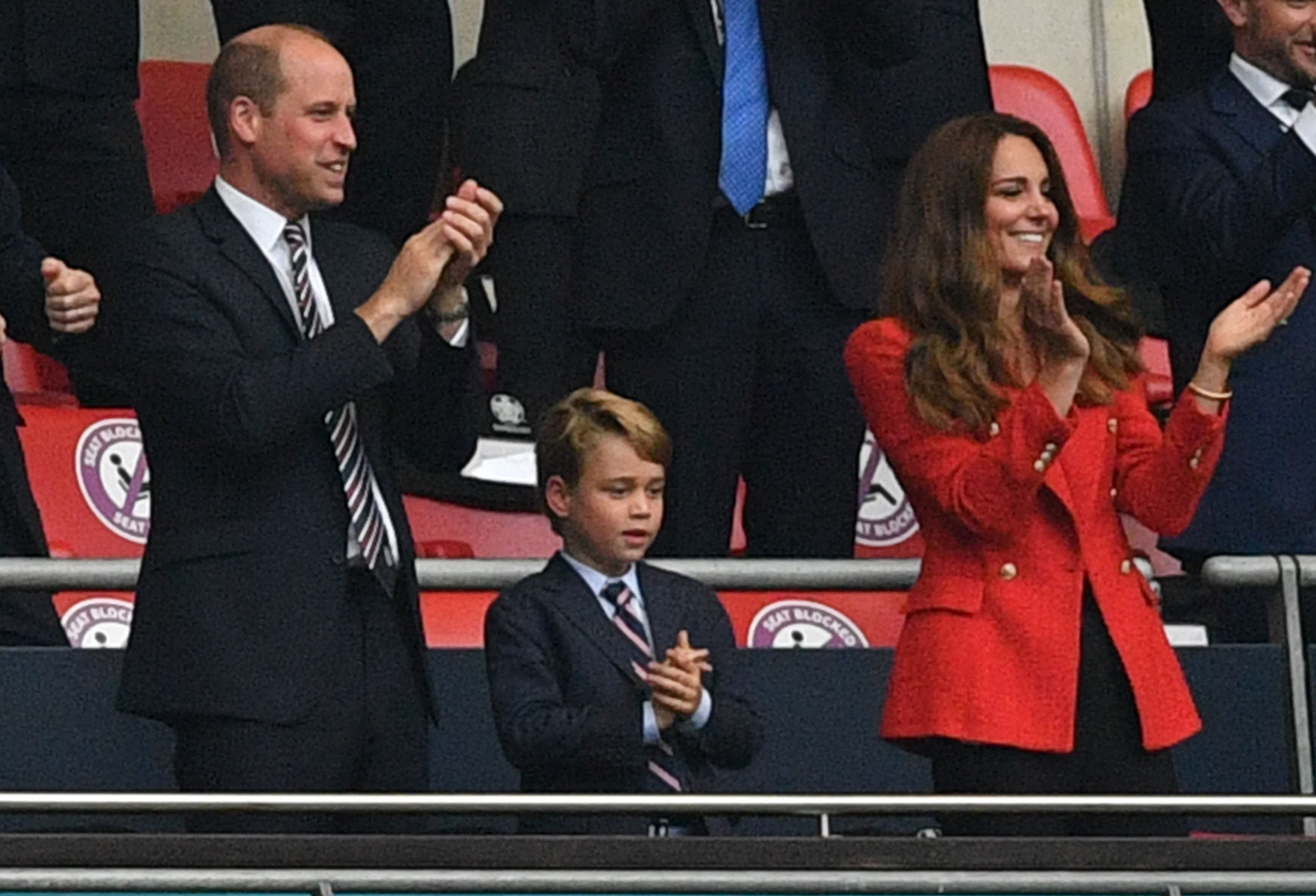 Prince William, Prince George, and Kate Middleton in the stands and clapping at the UEFA EURO football match between England and Germany