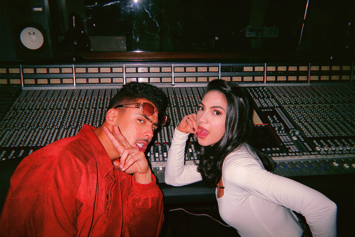 Quincy Brown as Crown Camacho and Natalee Linez as Jessica Figuero posing next to a sound mixing board in 'Power Book III" Raising Kanan'