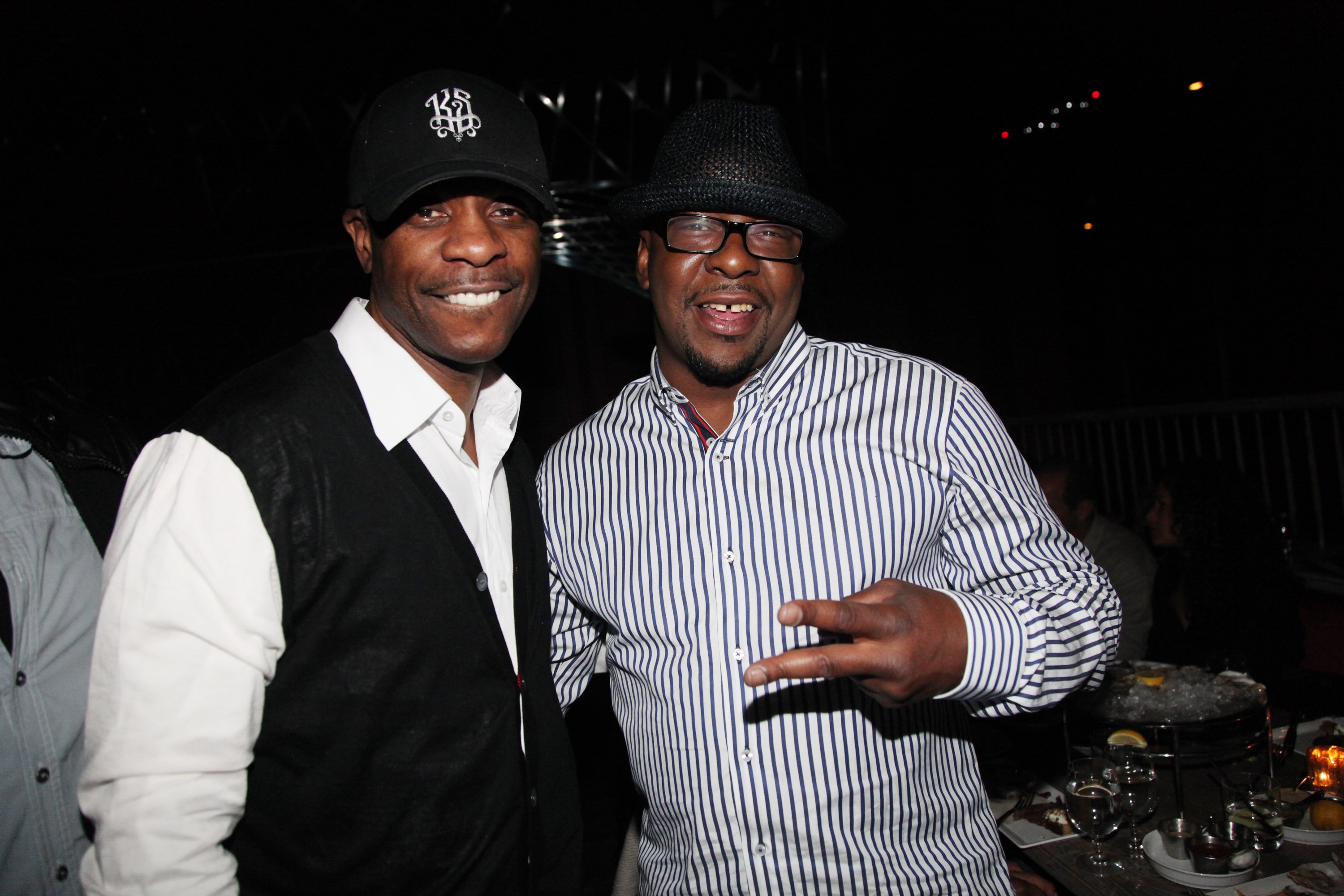 Keith Sweat and Bobby Brown pose for a photo together at a dinner in New York City
