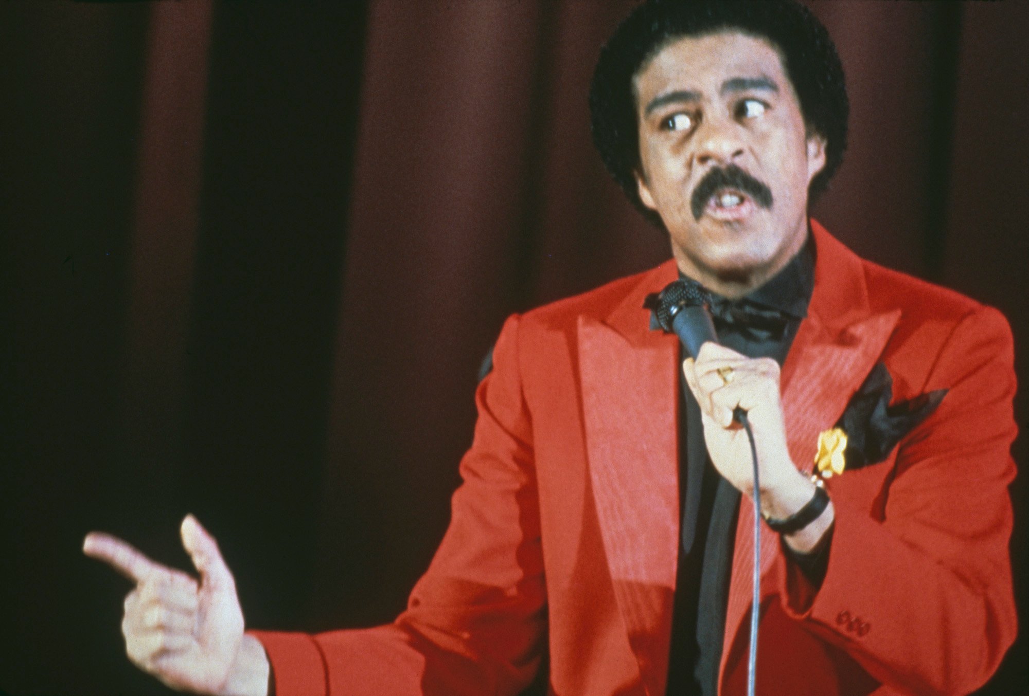 Richard Pryor does standup in a red suit