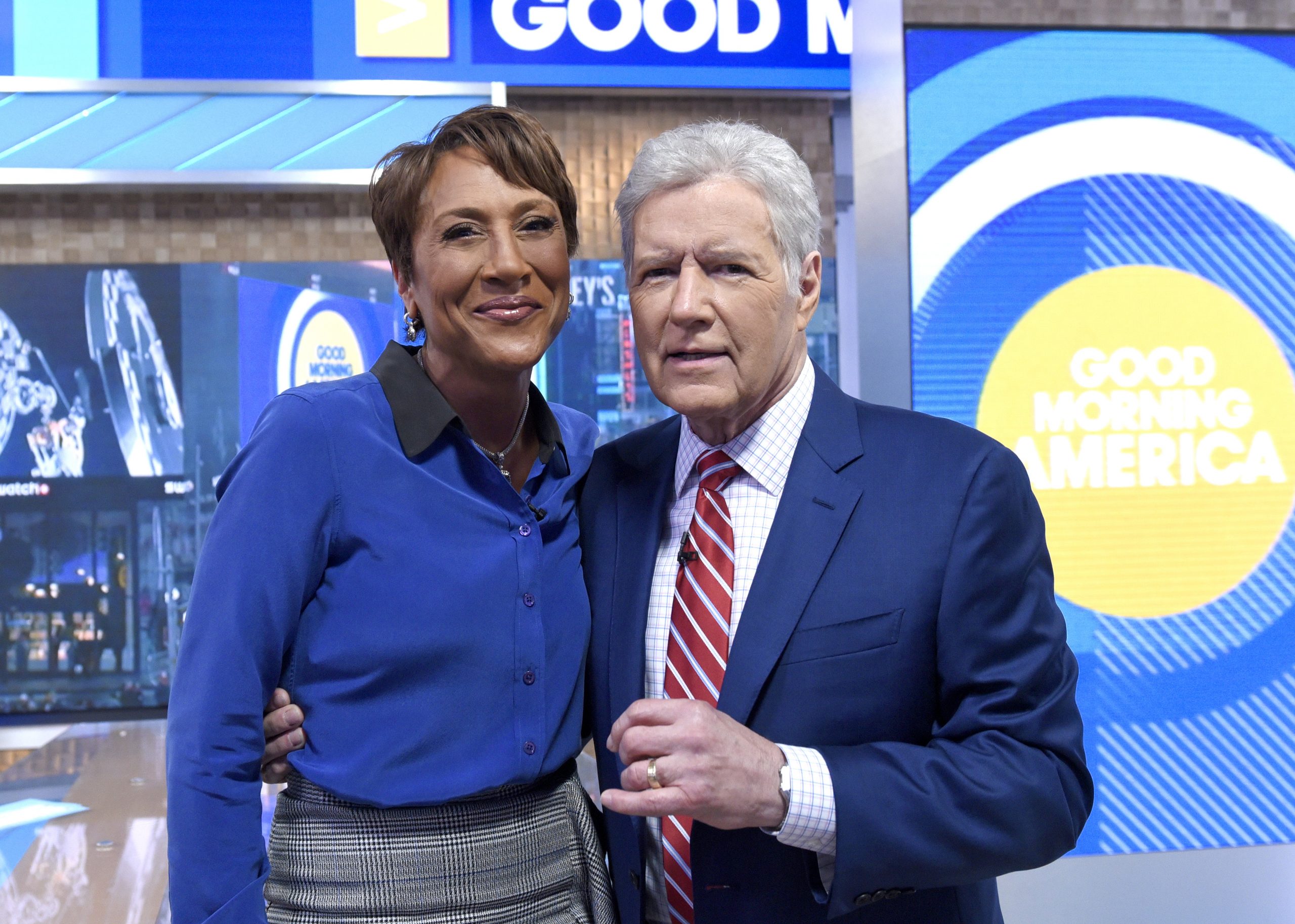 'GMA' coanchor Robin Roberts and late 'Jeopardy!' host Alex Trebek stop for a photo in the morning show's studios in 2019.