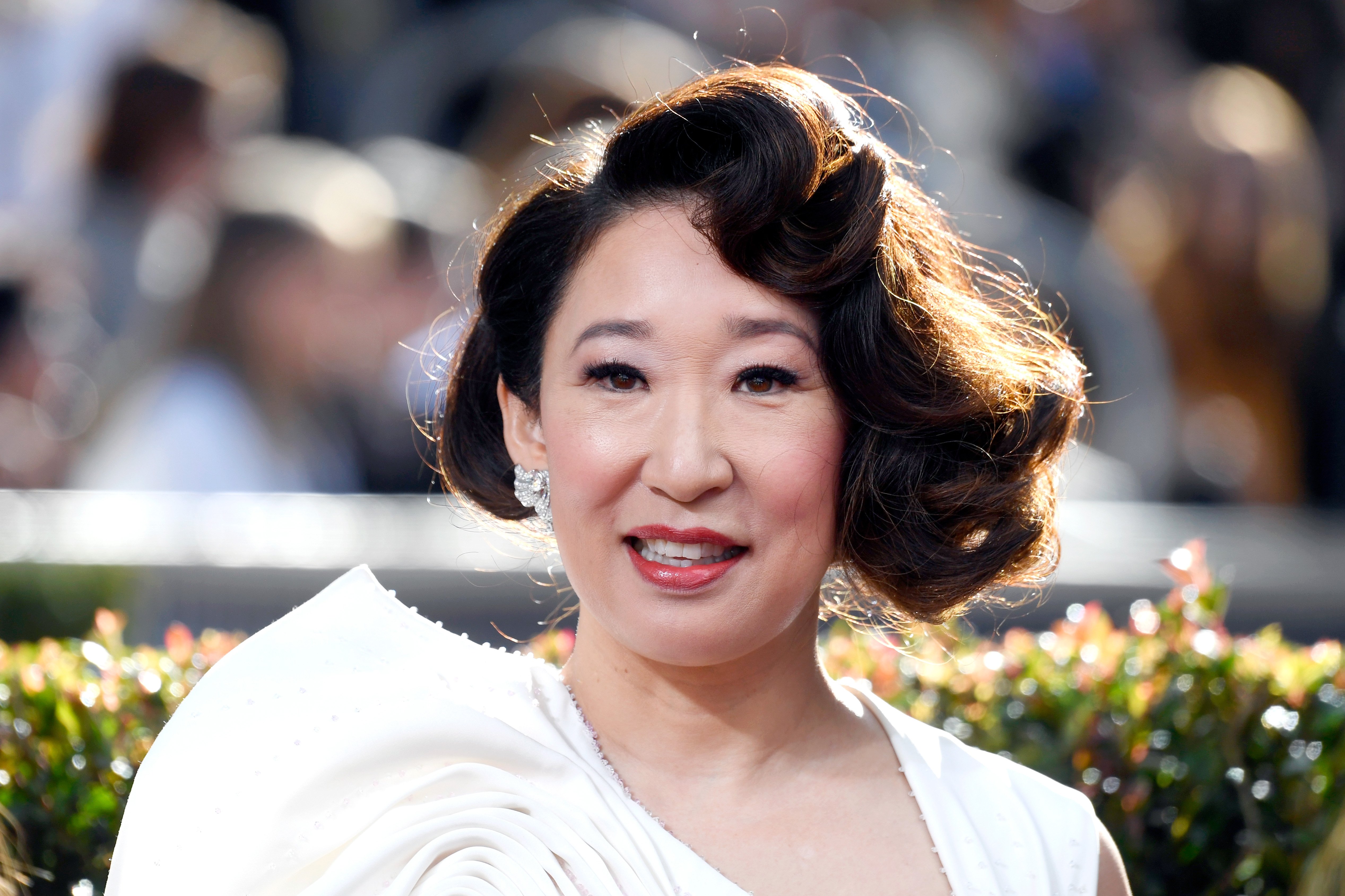 Sandra Oh from 'Grey's Anatomy' and 'Degrassi' smiling at an awards show.