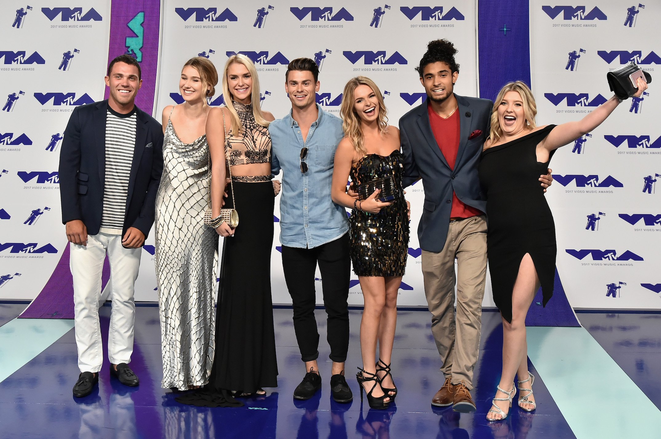 The cast of MTV's 'Siesta Key' in 2017 at the MTV Video Music Awards standing together and smiling