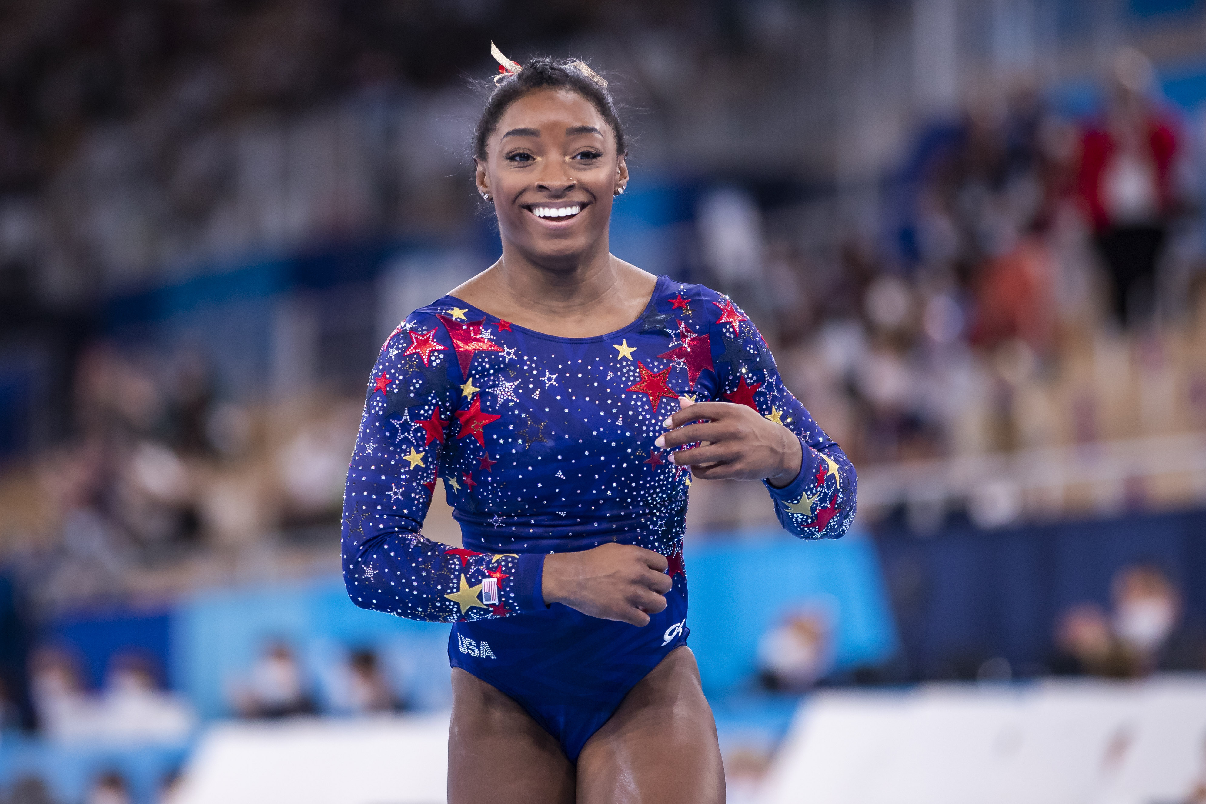 Simone Biles smiles during the qualification round of the women's gymnastics in Tokyo