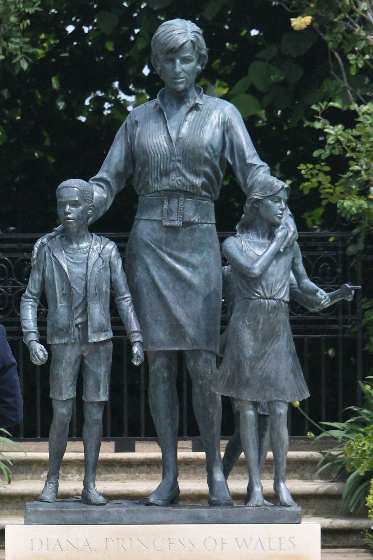 a statue of Princess Diana with her arms around children