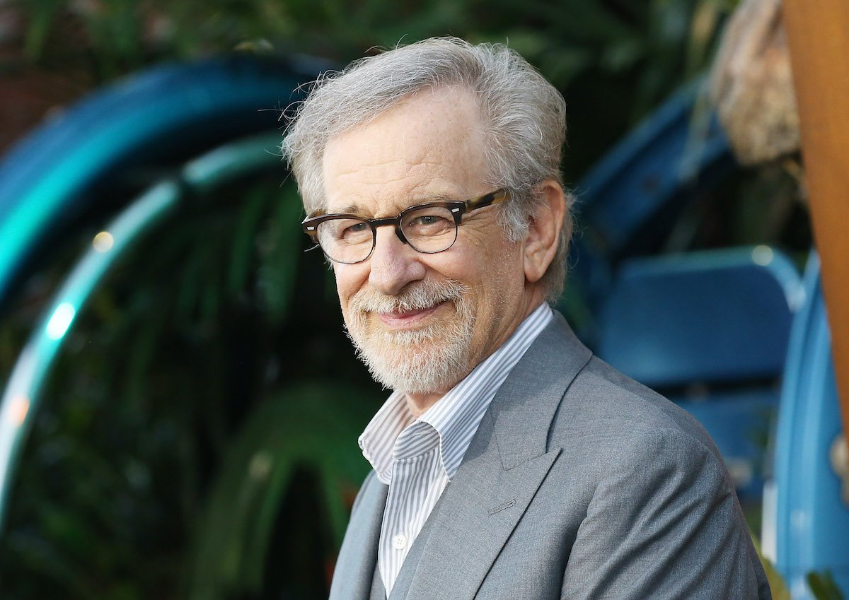 Steven Spielberg wears a suit and smiles
