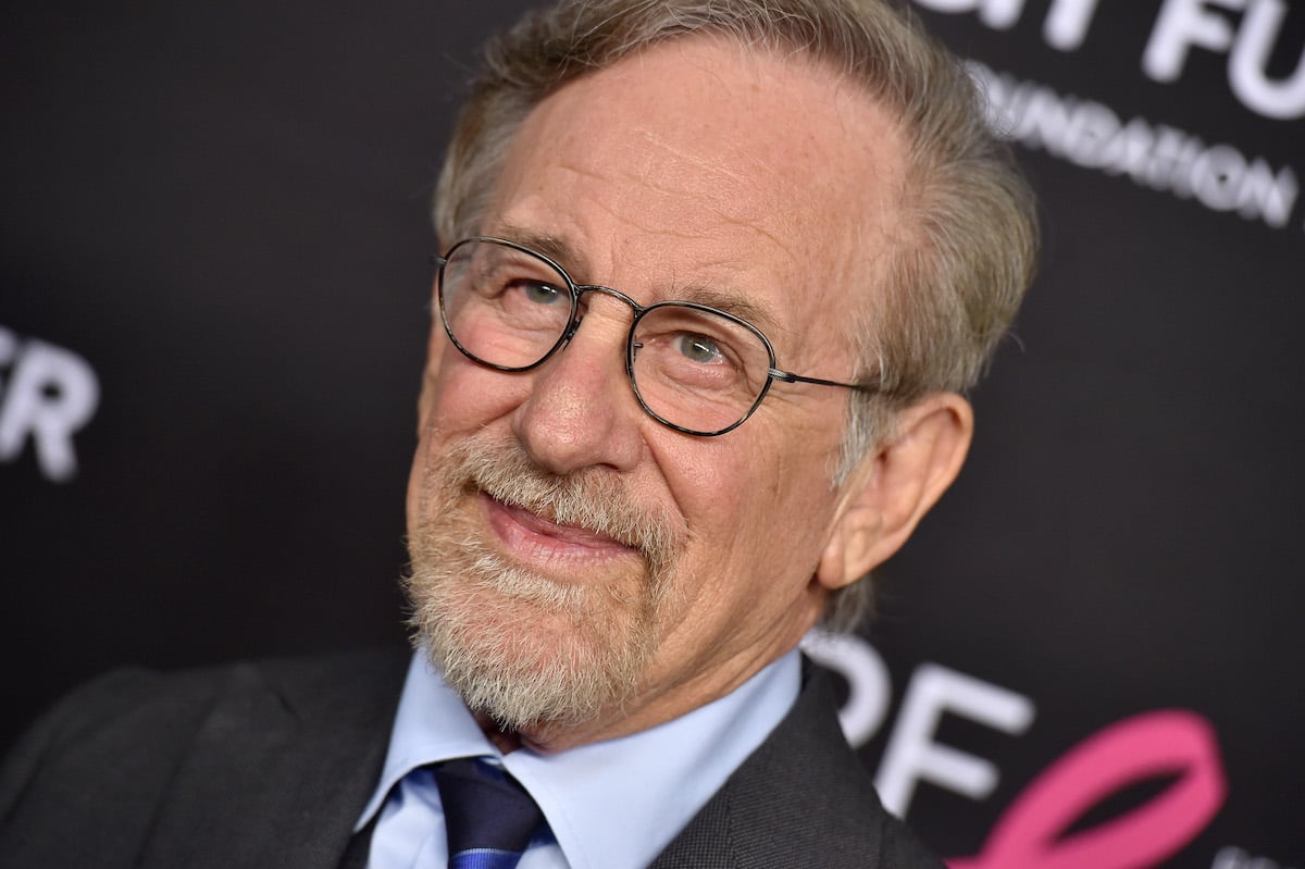 Steven Spielberg wears a suit and smiles