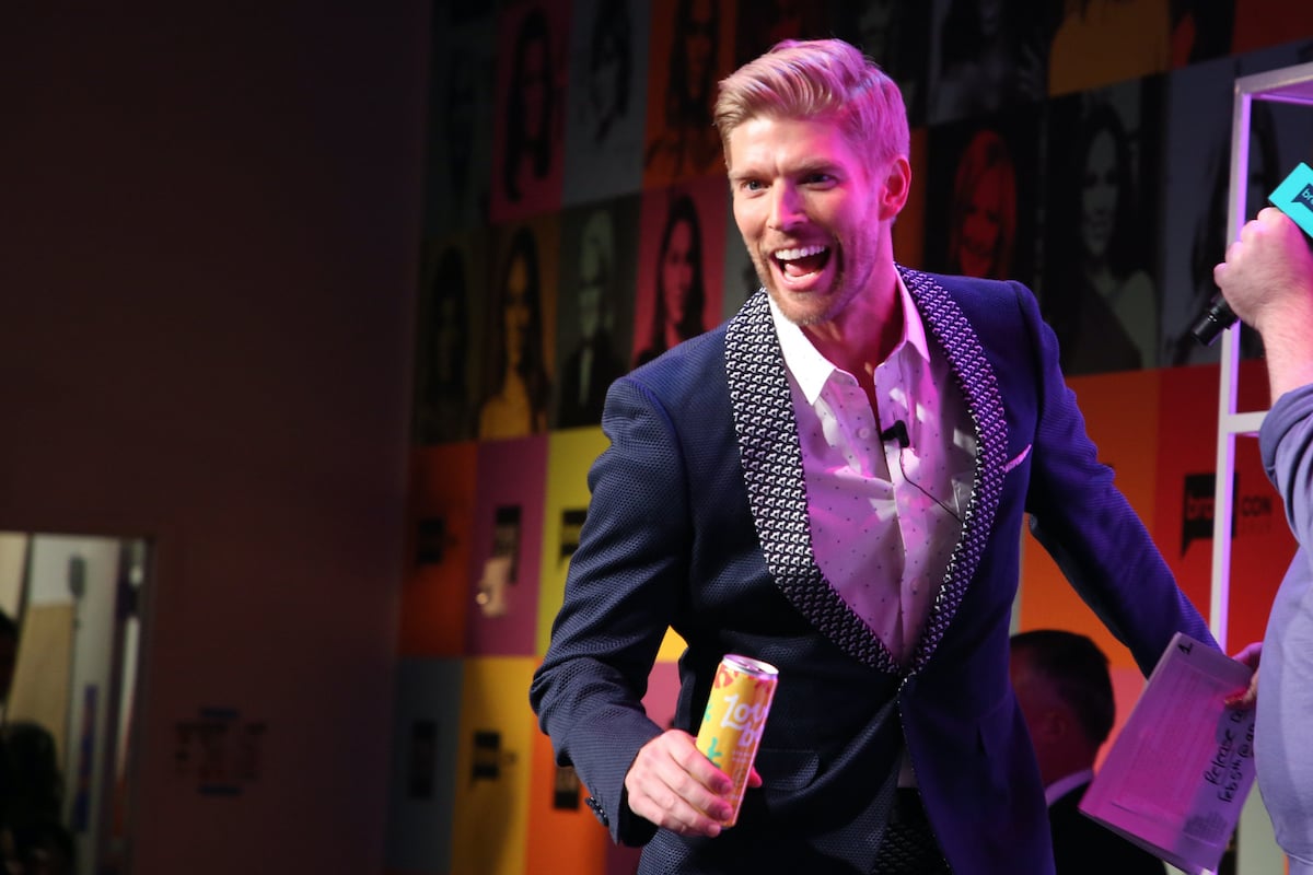 Kyle Cooke from Summer House holds a can of Loverboy during BravoCon 2019