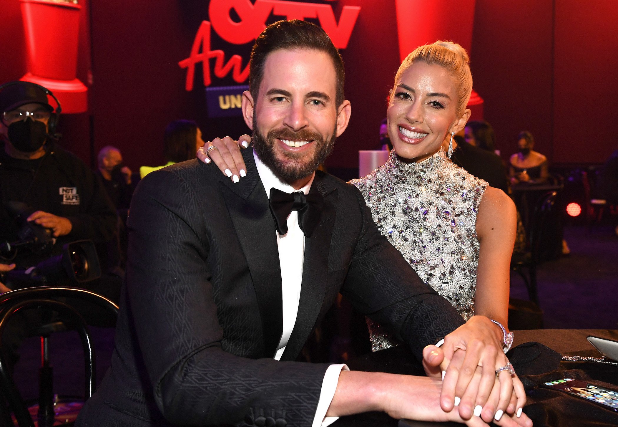 Heather Rae Young of 'Selling Sunset' Season 4 with her arm around Tarek El Moussa at the MTV Movie and TV Awards