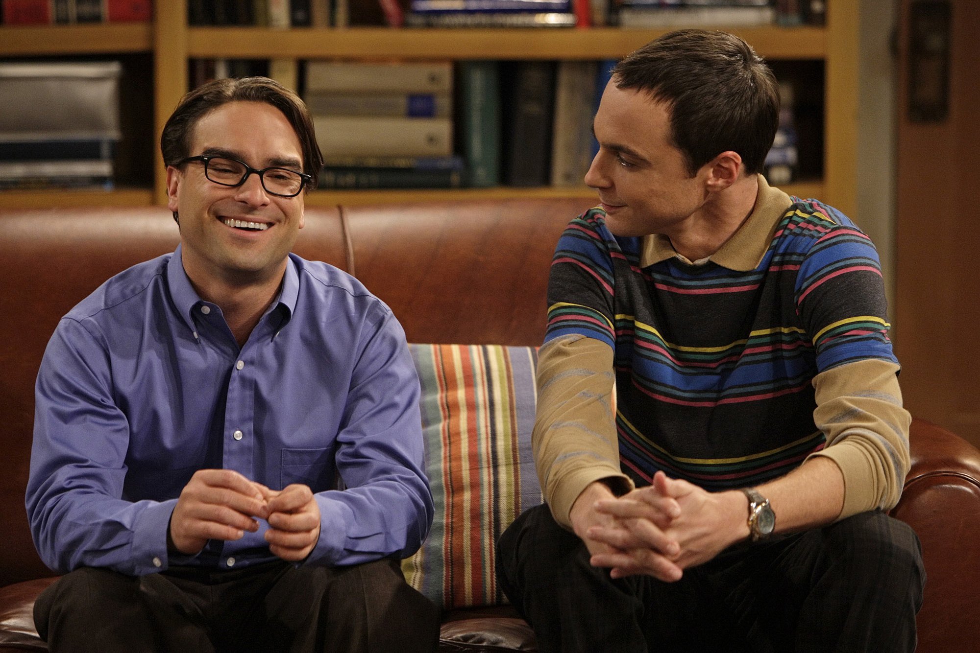 Leonard Hofstadter and Sheldon Cooper sit on the couch in their apartment in an episode of 'The Big Bang Theory'