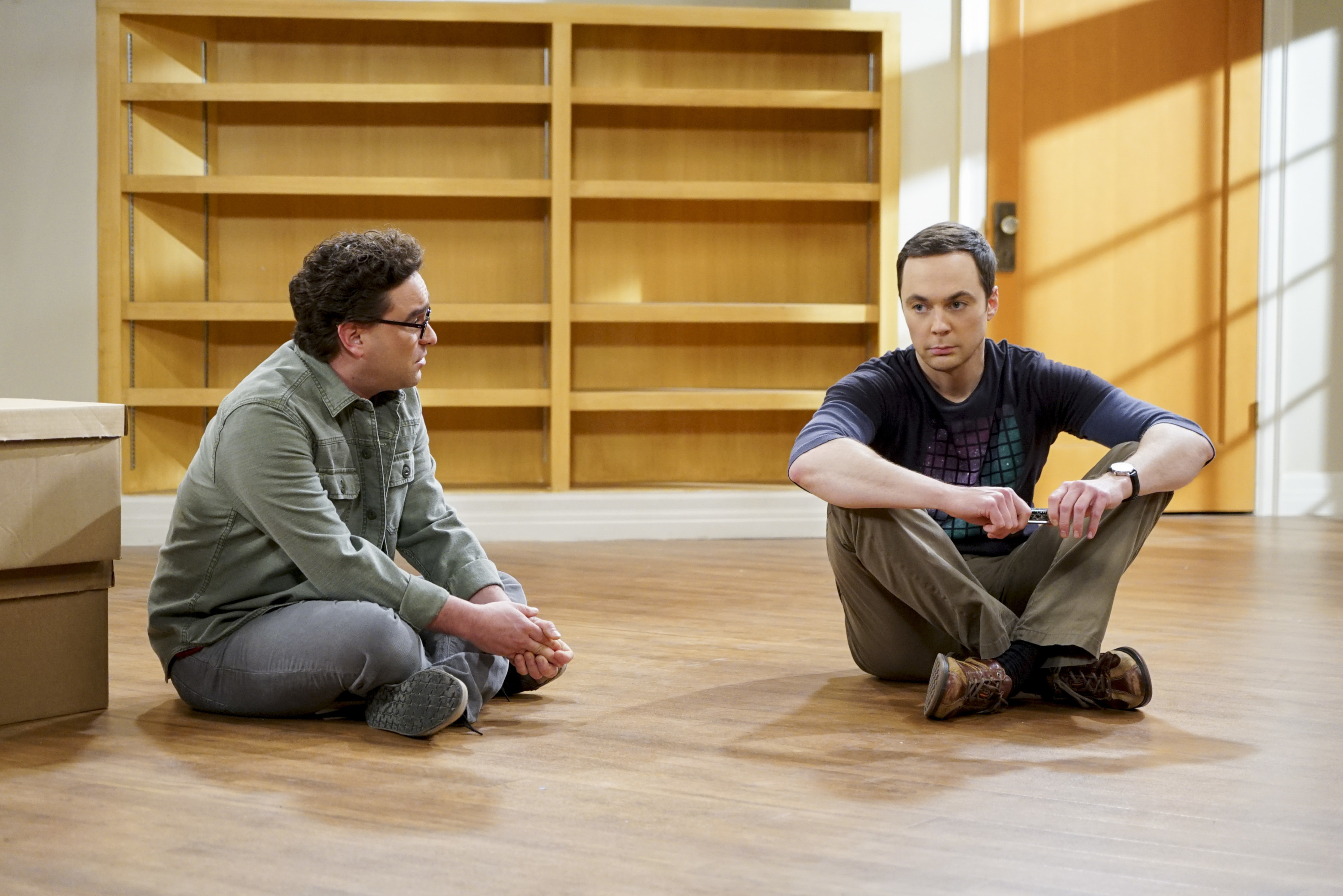 Leonard Hofstadter and Sheldon Cooper sit in their empty apartment during the finale of 'The Big Bang Theory' 