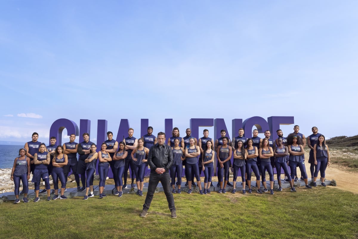 MTV's 'The Challenge' Season 37 cast standing outside with host T.J. Lavin in front of them