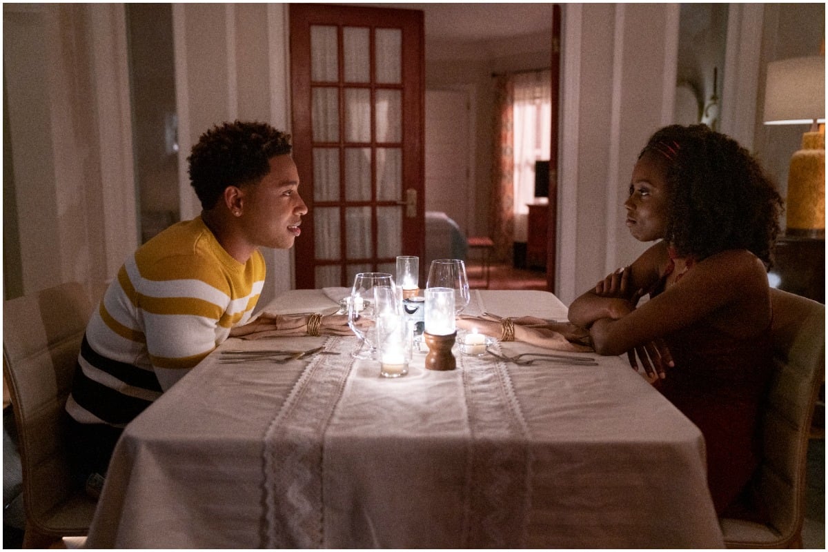 'The Chi' actors Jacob Latimore and Birgundi Baker as Emmett and Kiesha smiling at dinner.
